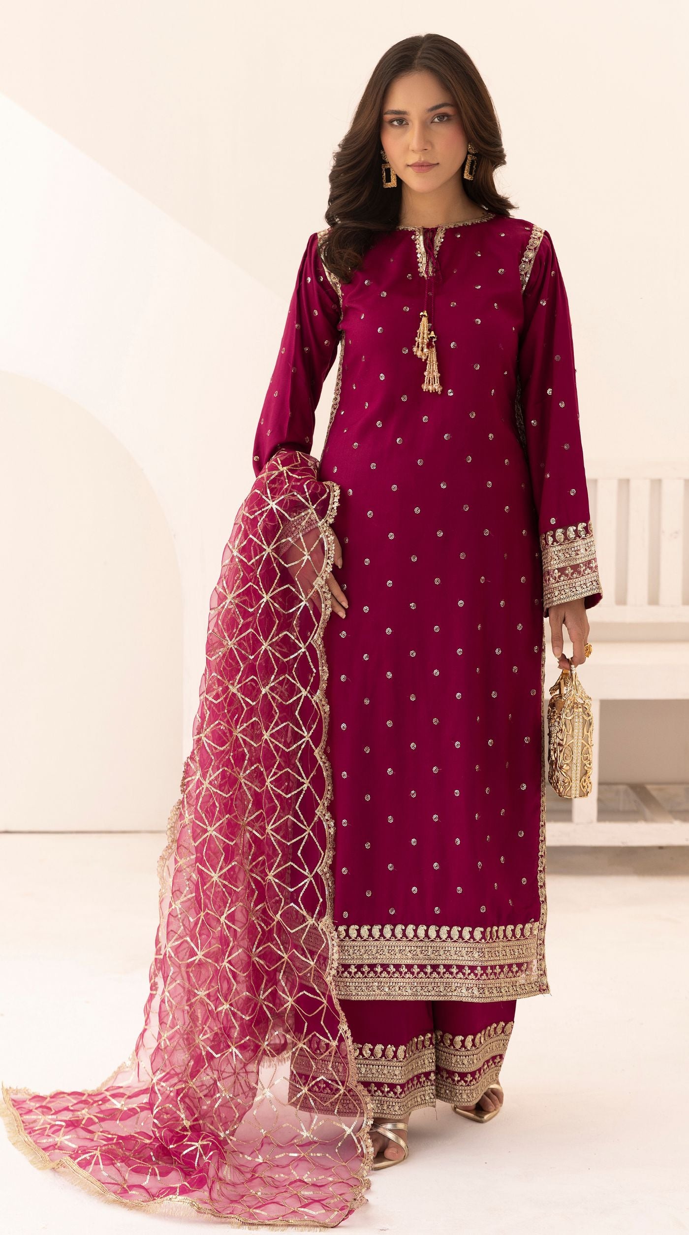 Magenta embroidered viscose suit set with embellished detailing and an intricately embroidered net dupatta.