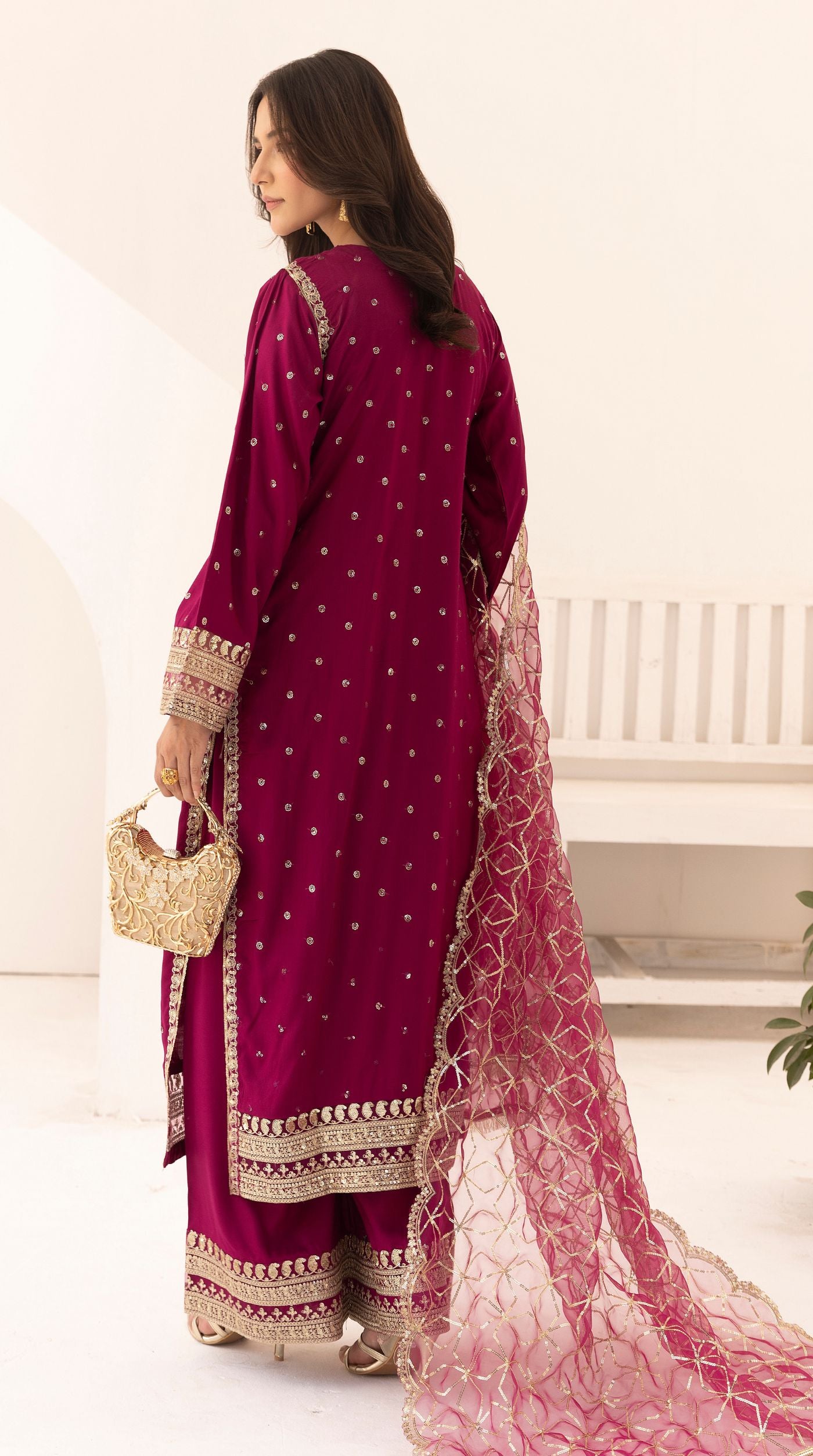 Magenta embroidered viscose suit set with embellished detailing and an intricately embroidered net dupatta.
