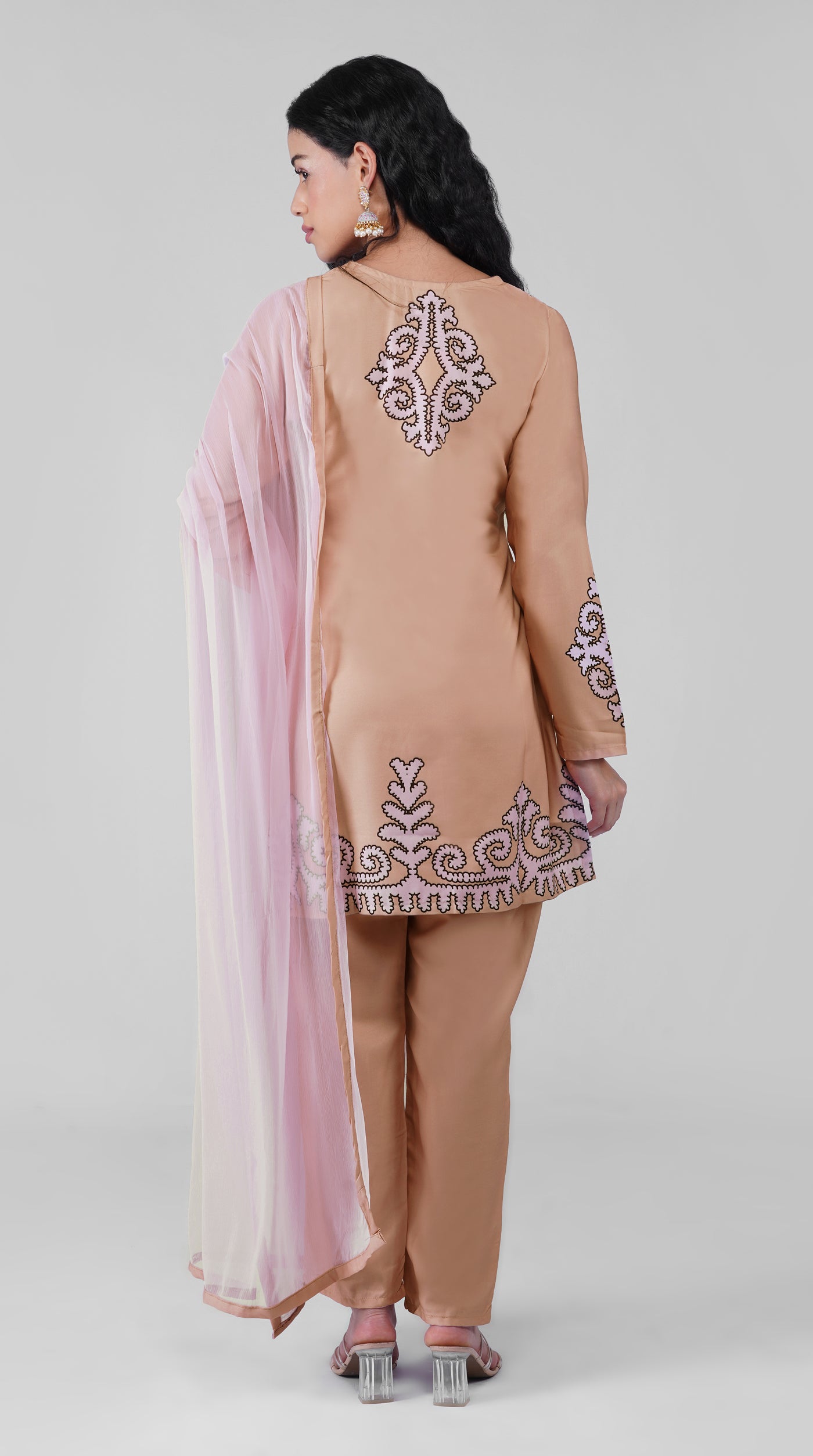 Full-length beige printed suit with matching trousers