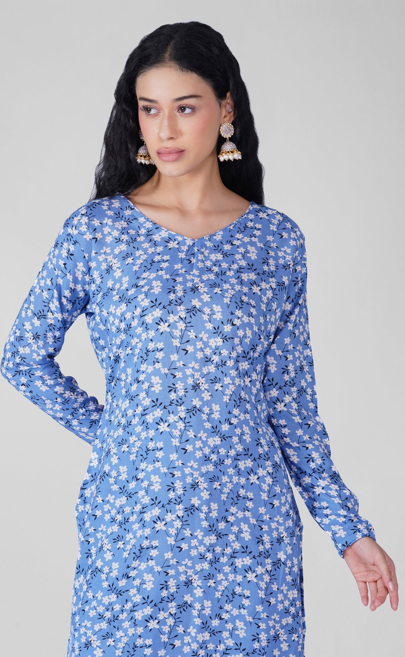 Back view of blue floral print suit with white chiffon dupatta