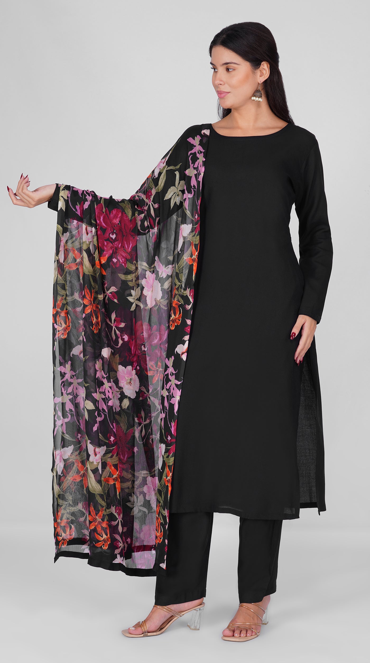 Black straight cut suit set modeled with a plain black kurta and pants paired with a sheer floral georgette dupatta in pink, purple and orange tones