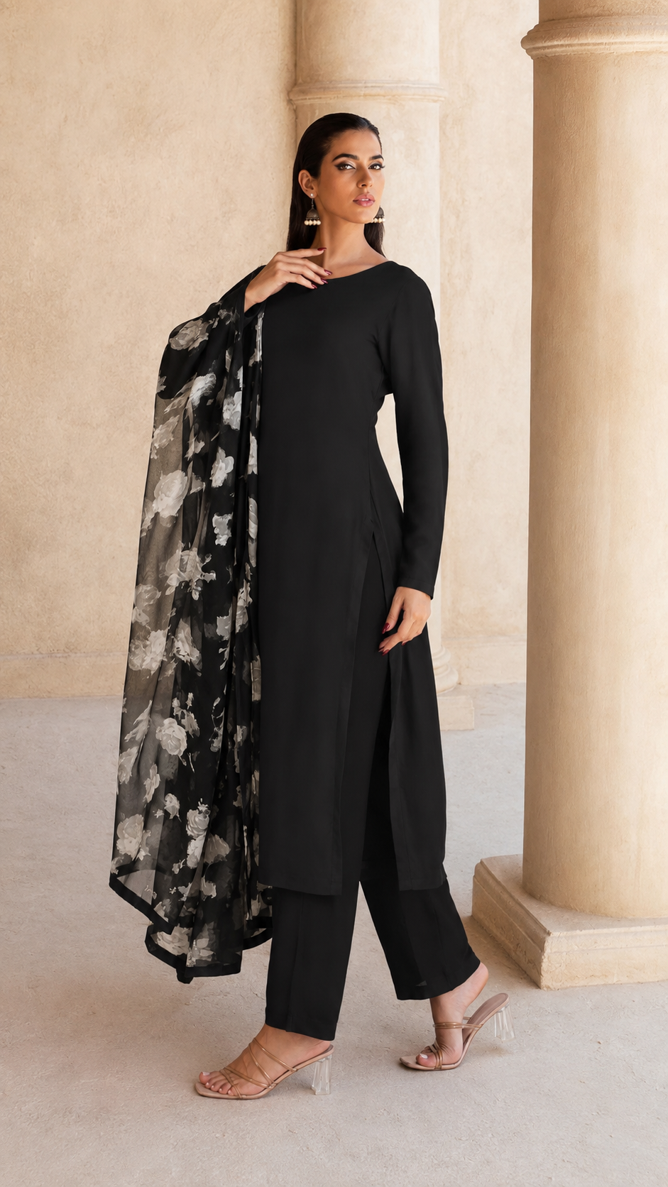 Black salwar kameez suit with wide-leg trousers and sheer black and white floral printed dupatta