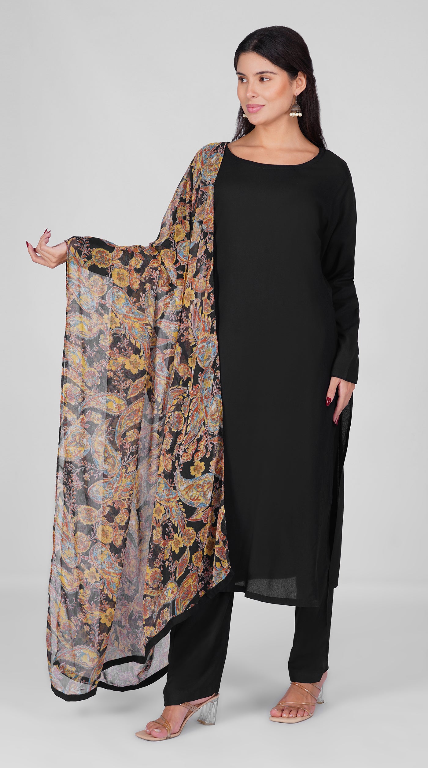 Black straight cut suit set modeled with a plain black kurta and pants paired with a sheer vintage paisley and floral printed georgette dupatta