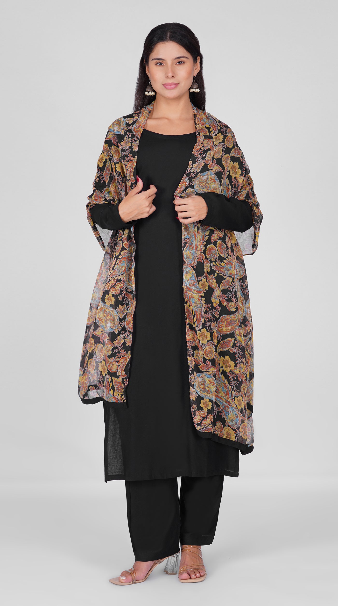 Black straight cut suit set modeled with a plain black kurta and pants paired with a sheer vintage paisley and floral printed georgette dupatta