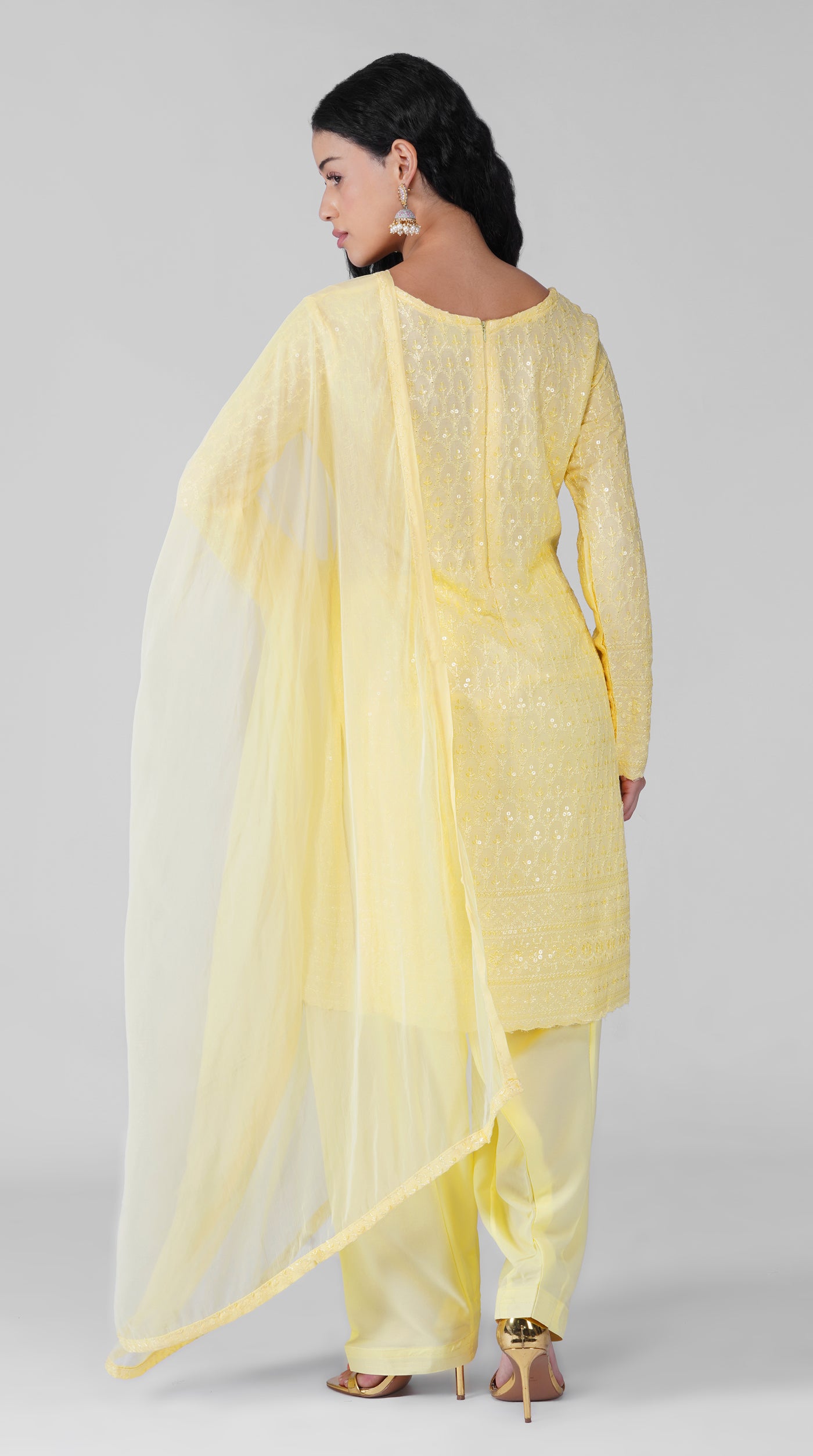 Side view of lemon yellow rayon suit with embroidered dupatta