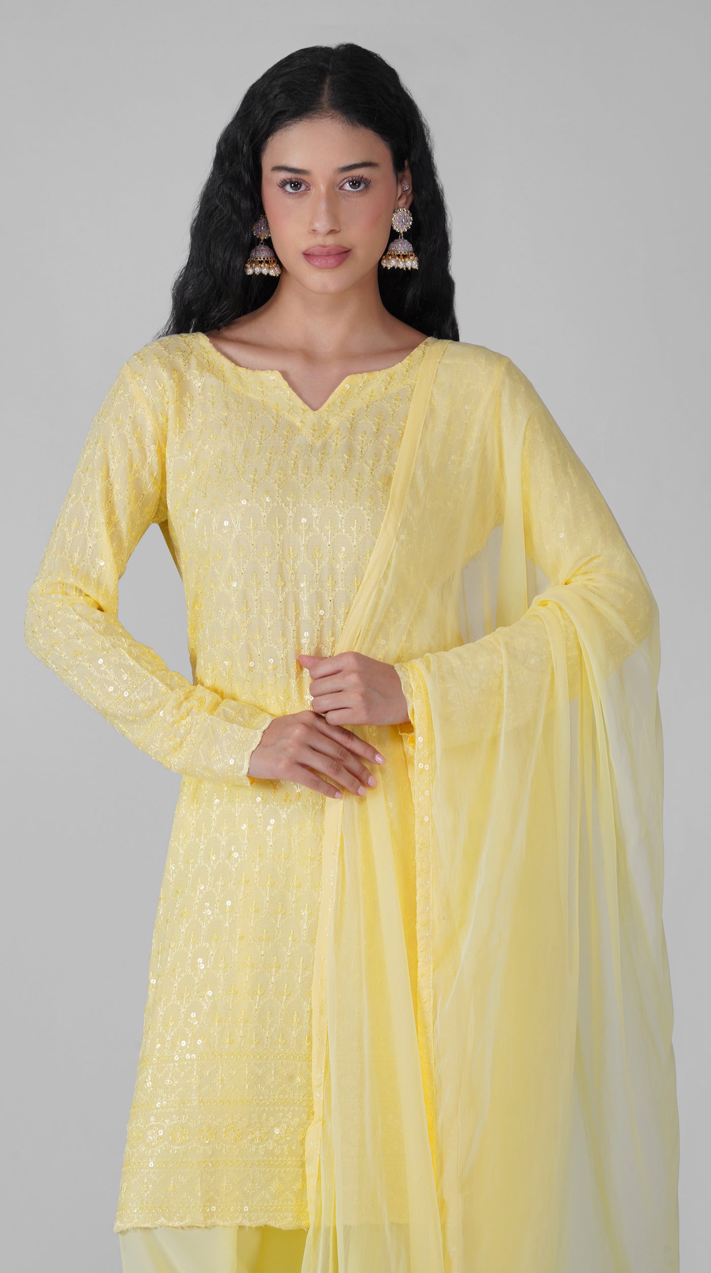 Close-up of Chikankari embroidery on lemon yellow kurta
