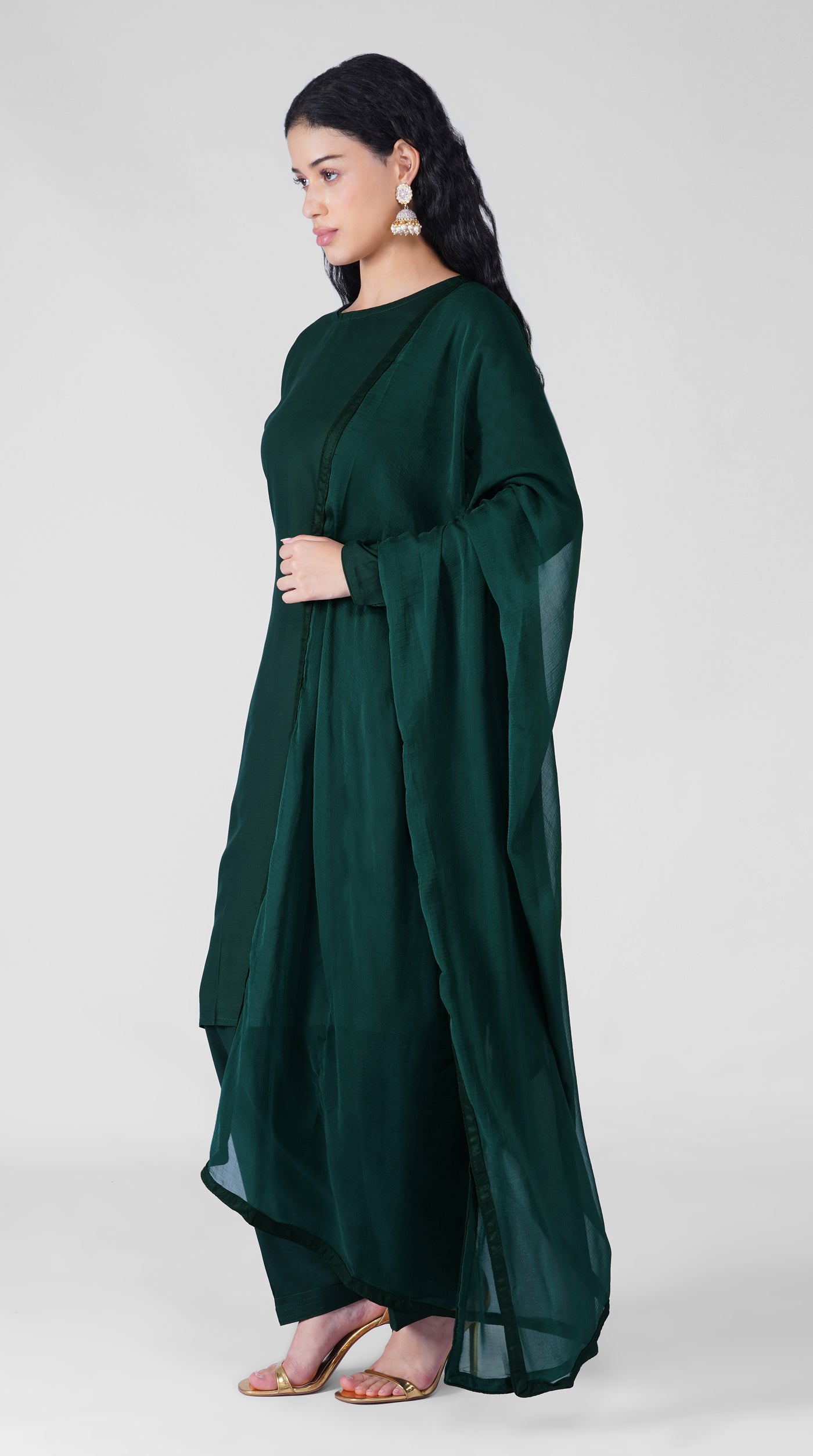 Back view of dark green rayon suit with chiffon dupatta