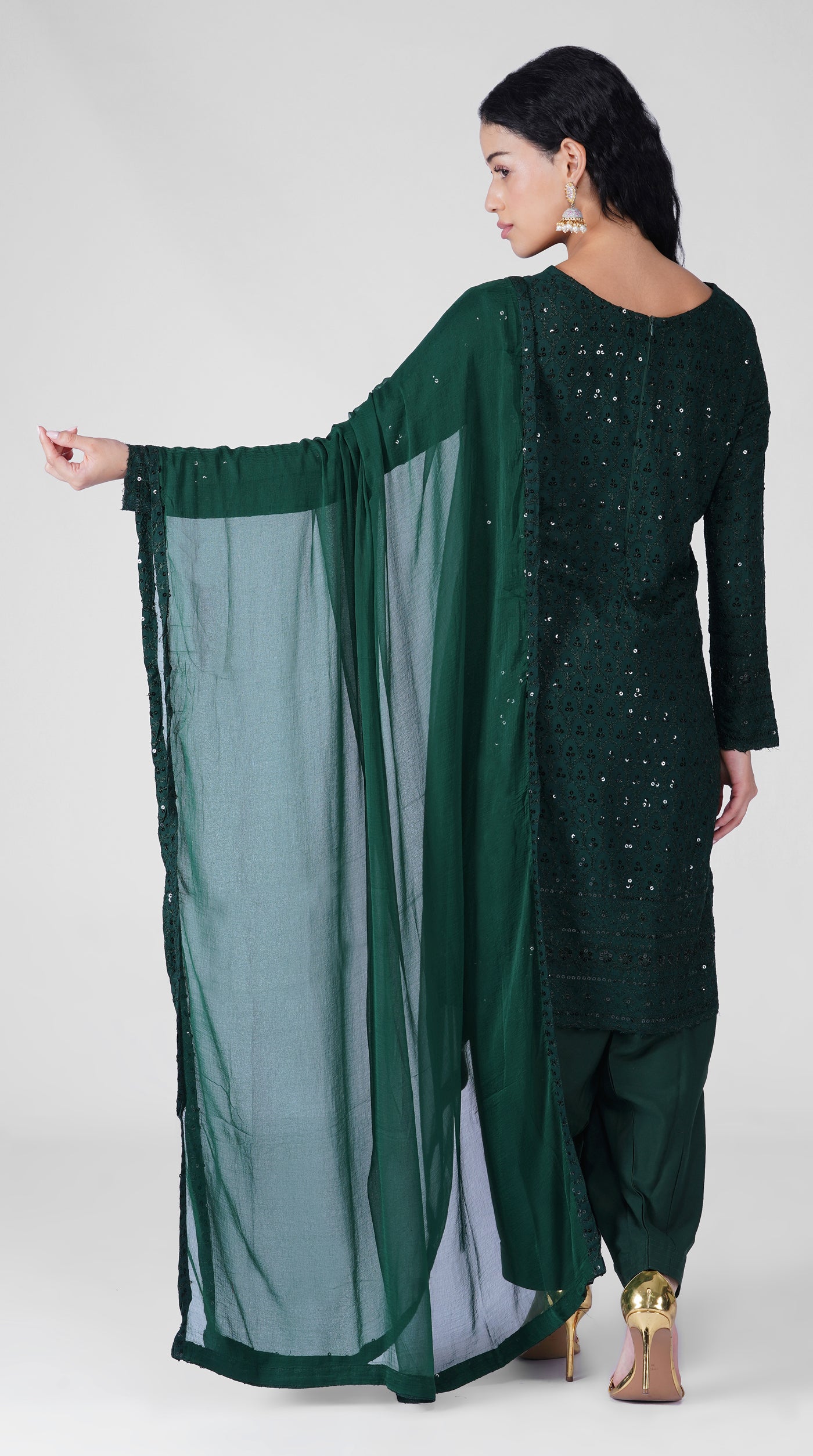 Side profile of dark green Chikankari rayon suit