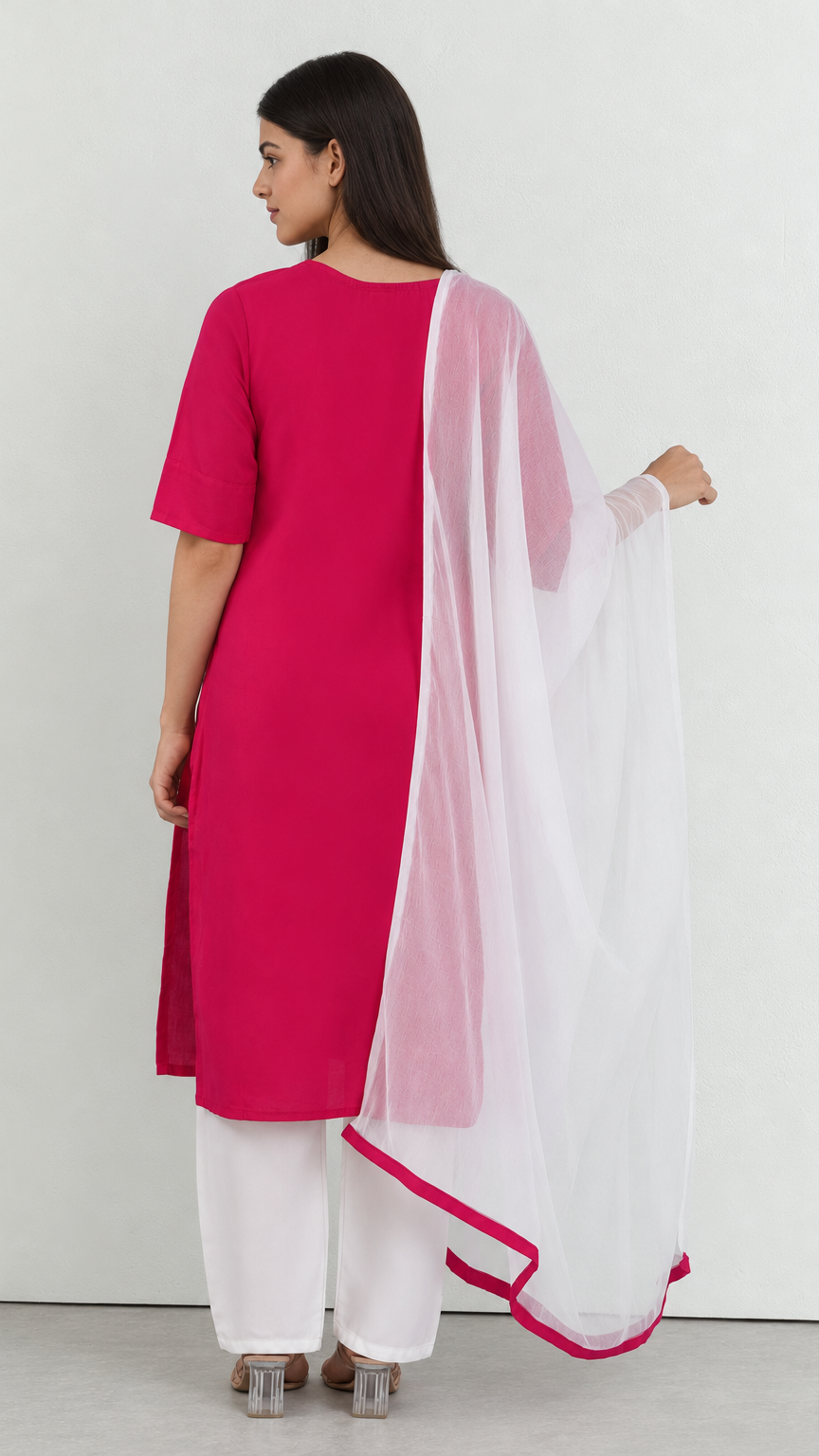 Pink threadwork kurta set paired with white trousers and dupatta