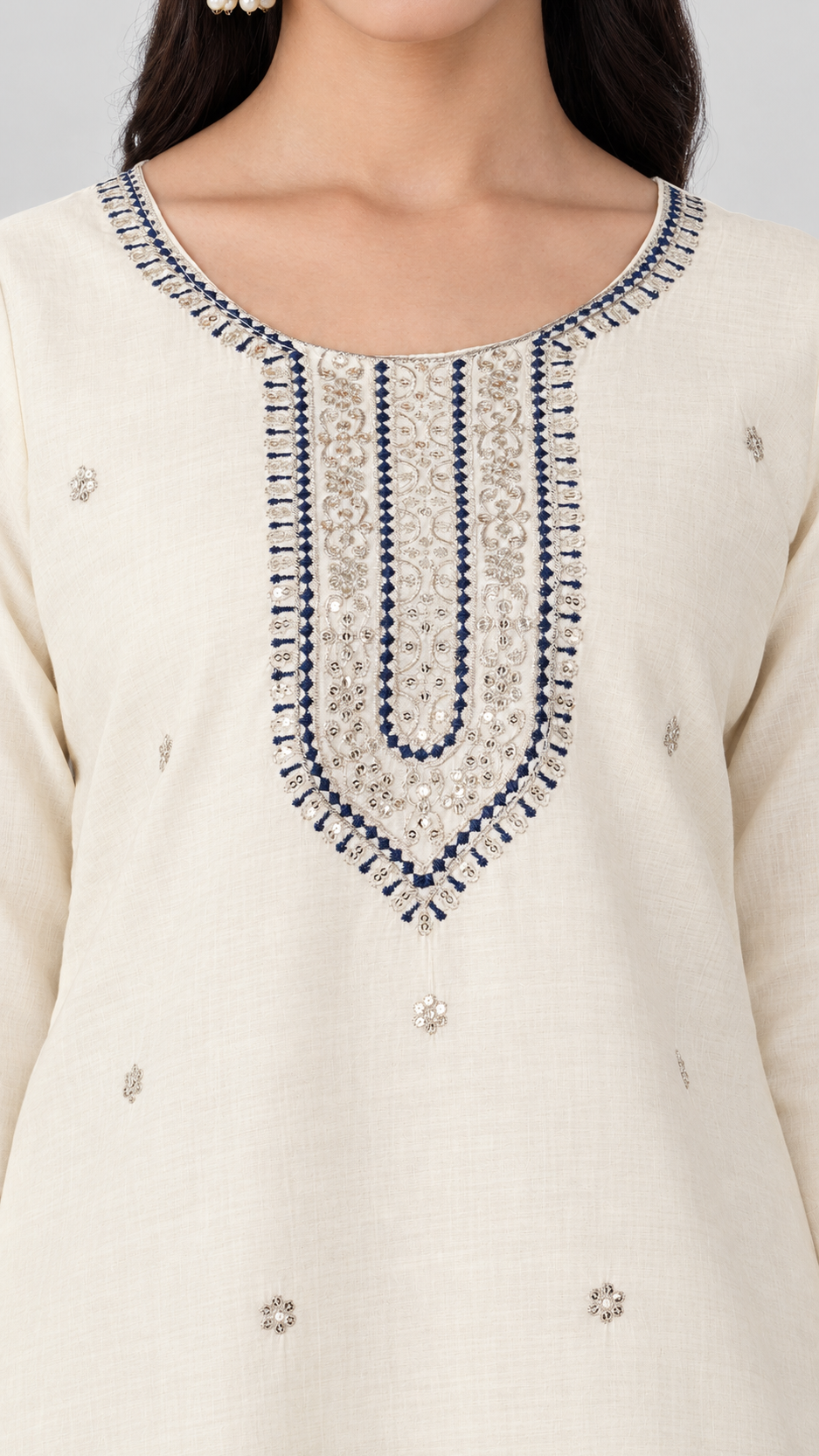 White Gold embroidery with navy blue thread work on a cream kameez and trouser suit with blue woven dupatta.