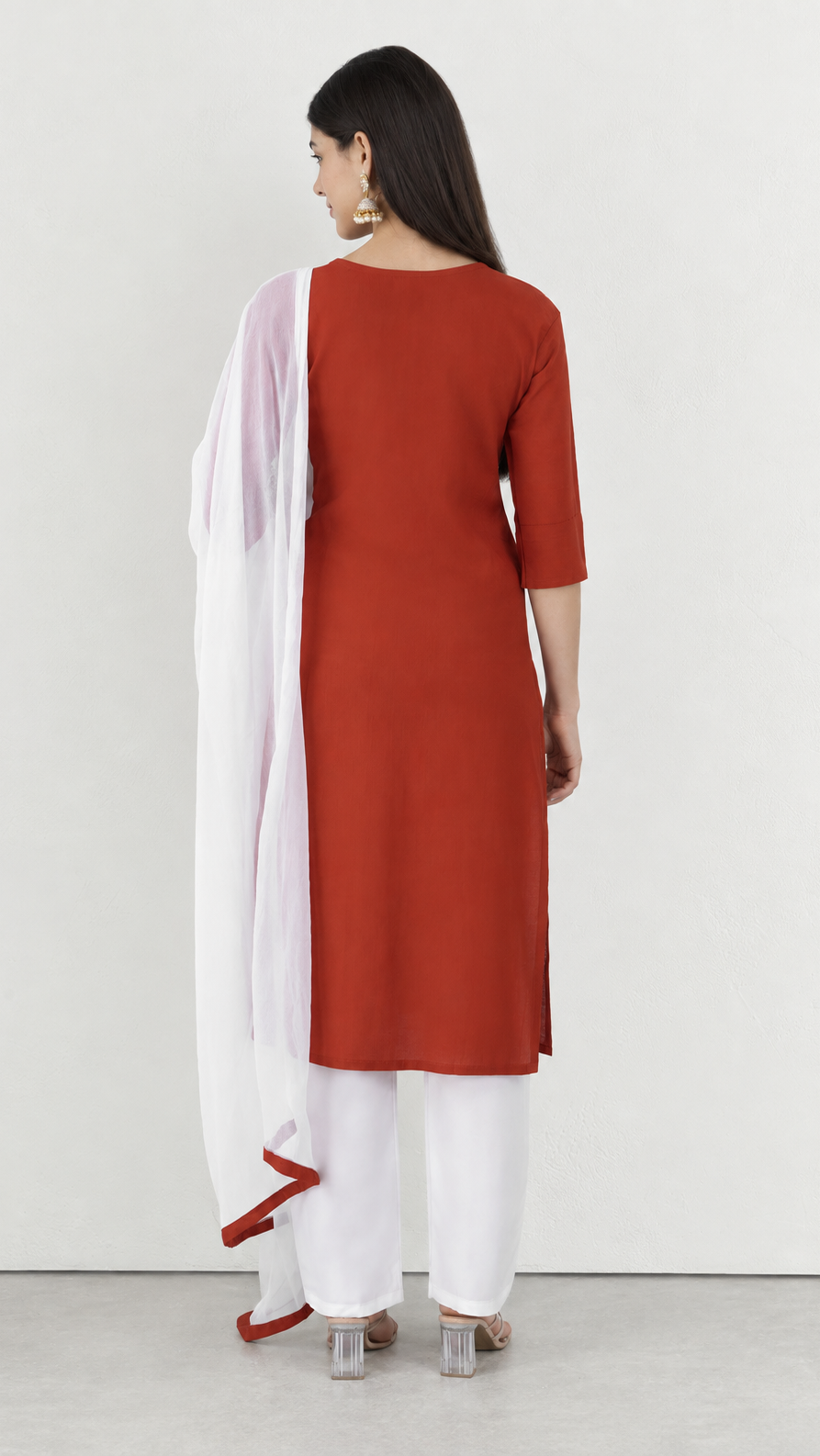 Rust cotton kurta suit with detailed threadwork and white trousers
