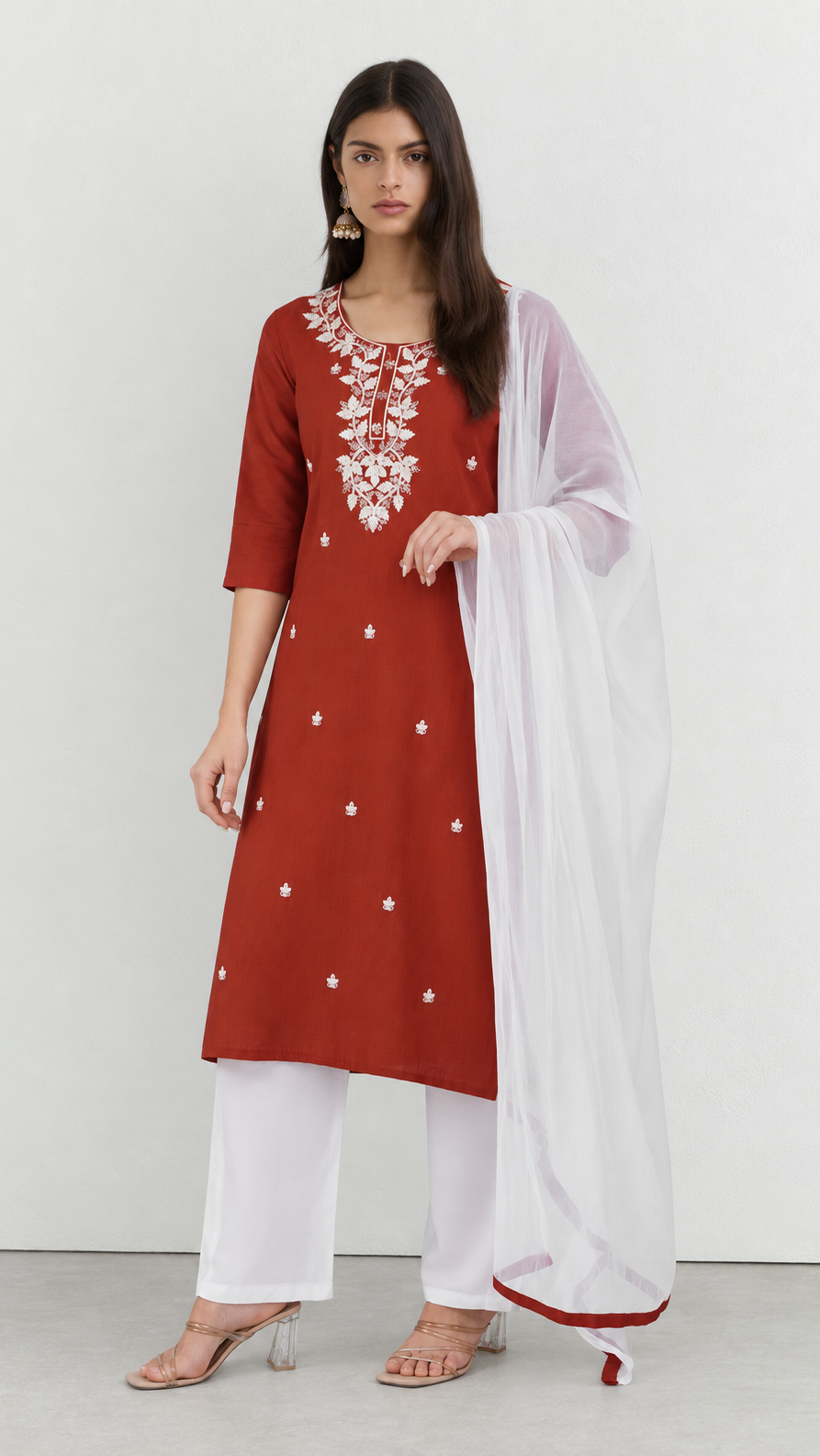 Rust cotton kurta suit with detailed threadwork and white trousers