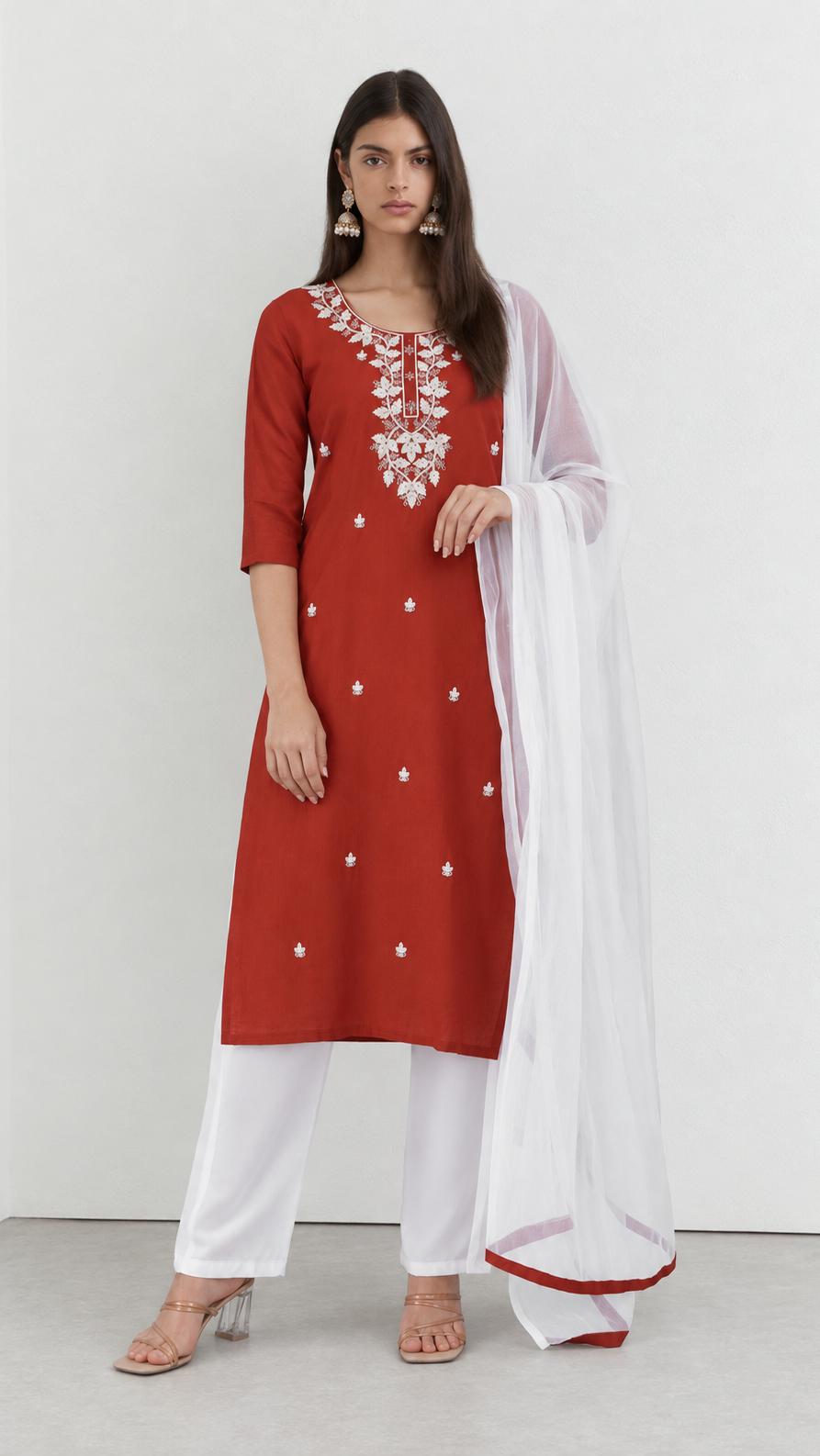 Rust cotton kurta suit with detailed threadwork and white trousers