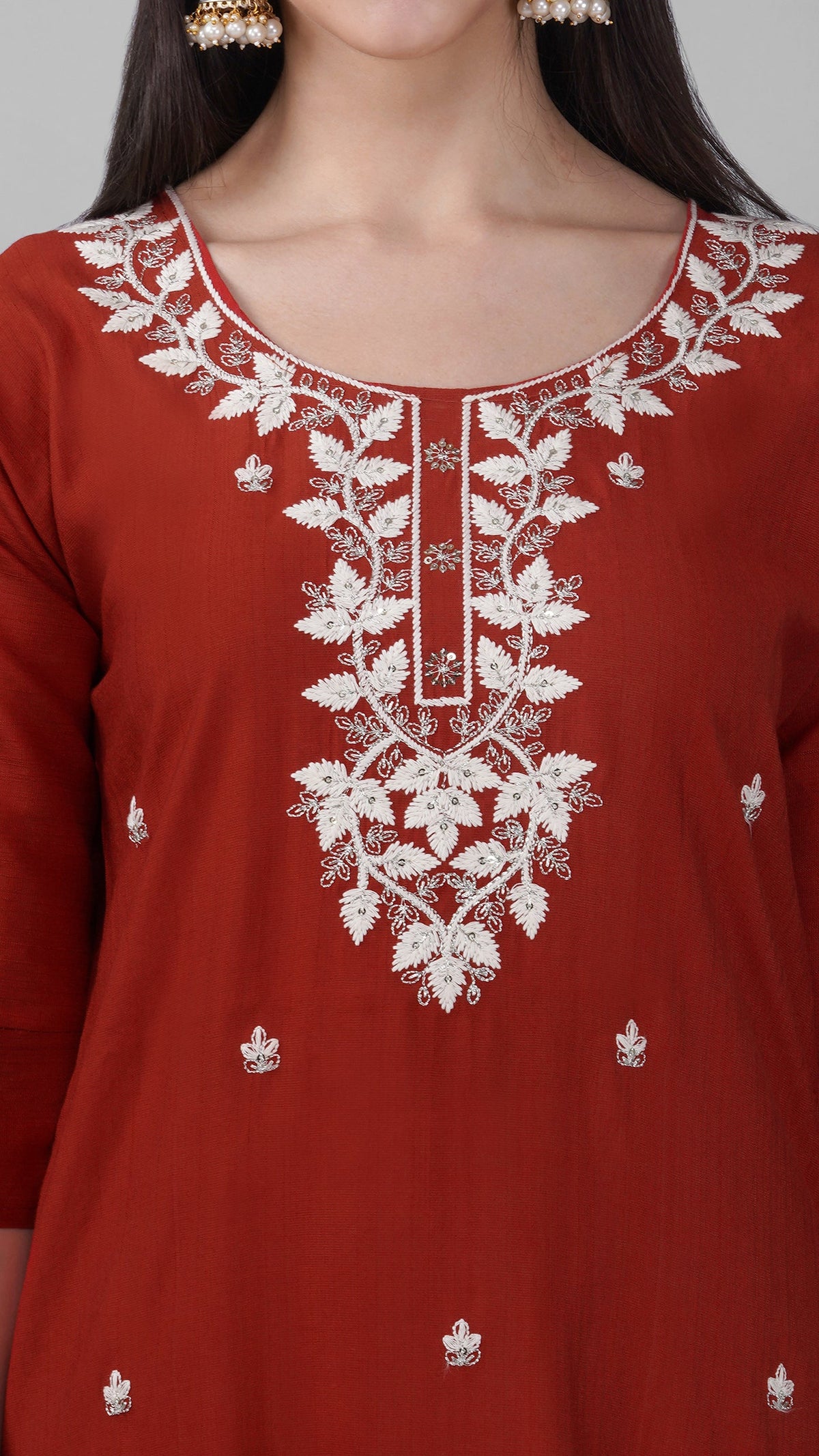 Rust cotton kurta suit with detailed threadwork and white trousers