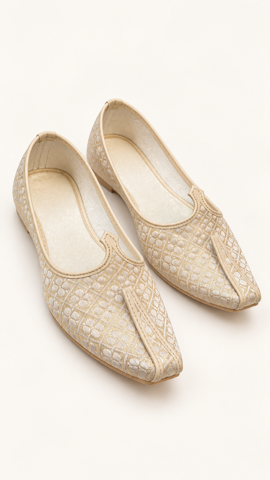A pair of light textured slip-on shoes with pointed toes