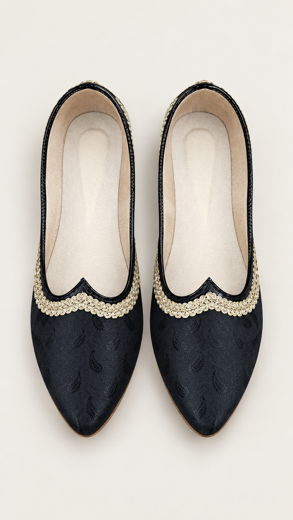 A pair of black pointed-toe flats with textured fabric and a decorative beige scalloped trim, shown from a top-down view on a light beige background.