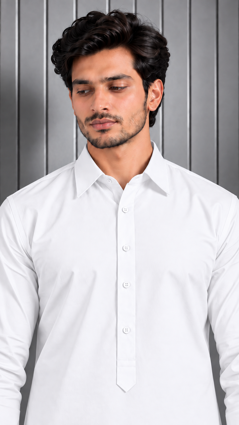 A man wearing a white long-sleeve button-up shirt, shown from the chest up against a gray paneled background.