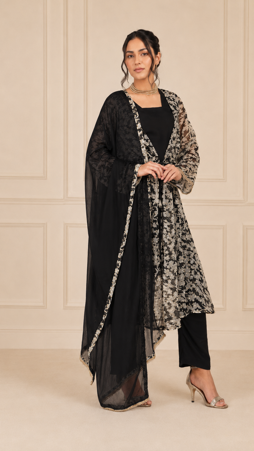 Black and ivory women’s floral salwar kameez suit with matching trousers and sheer black dupatta, elegant Asian ethnic wear by Diya Online