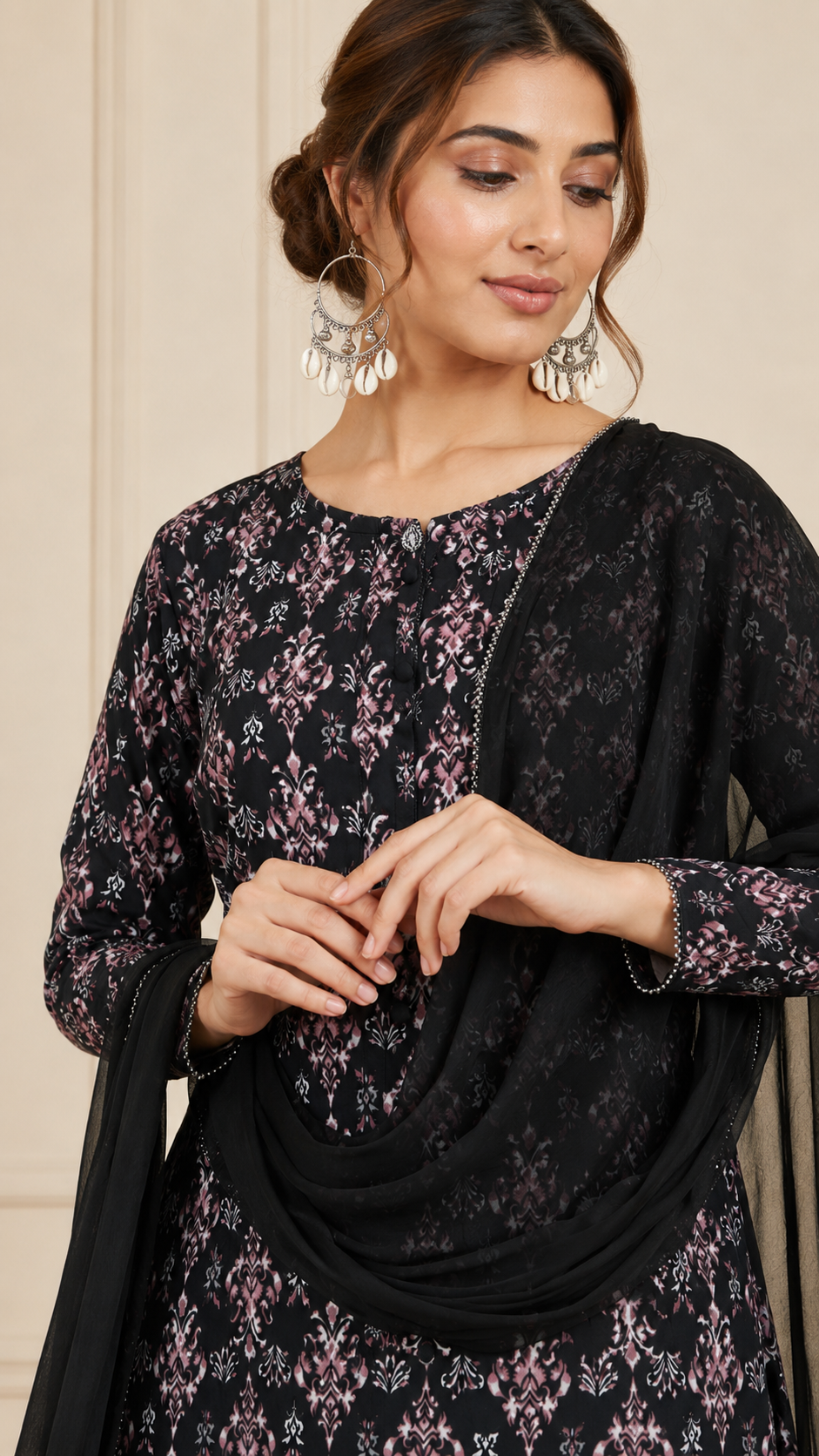 Black women’s floral printed salwar kameez suit with matching trousers and sheer chiffon dupatta, modest Asian ethnic wear by Diya Online