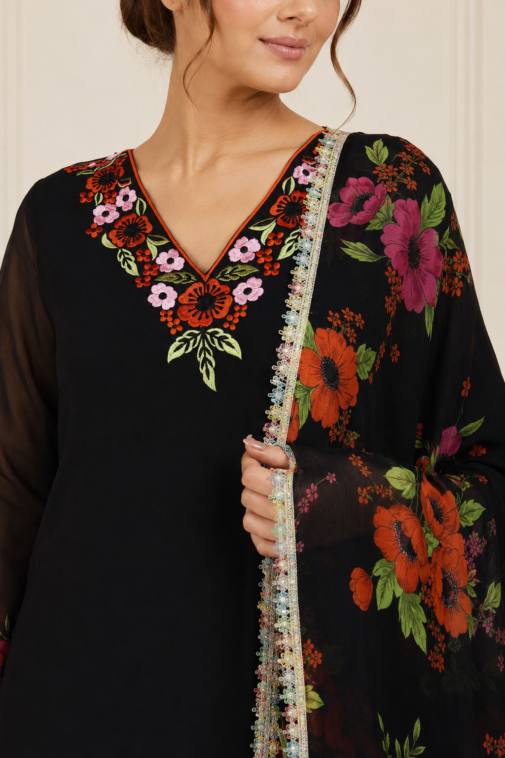 Black women’s embroidered salwar kameez suit with matching sharara trousers and floral printed dupatta, elegant Asian ethnic wear by Diya Online