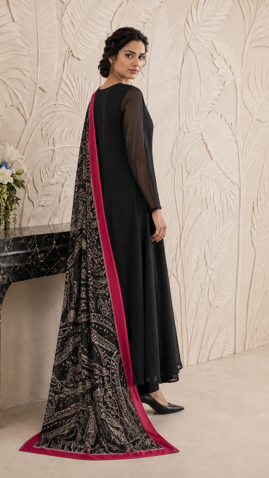 Black women’s Anarkali salwar kameez suit with matching trousers and black paisley printed dupatta with pink border, elegant Asian ethnic wear by Diya Online