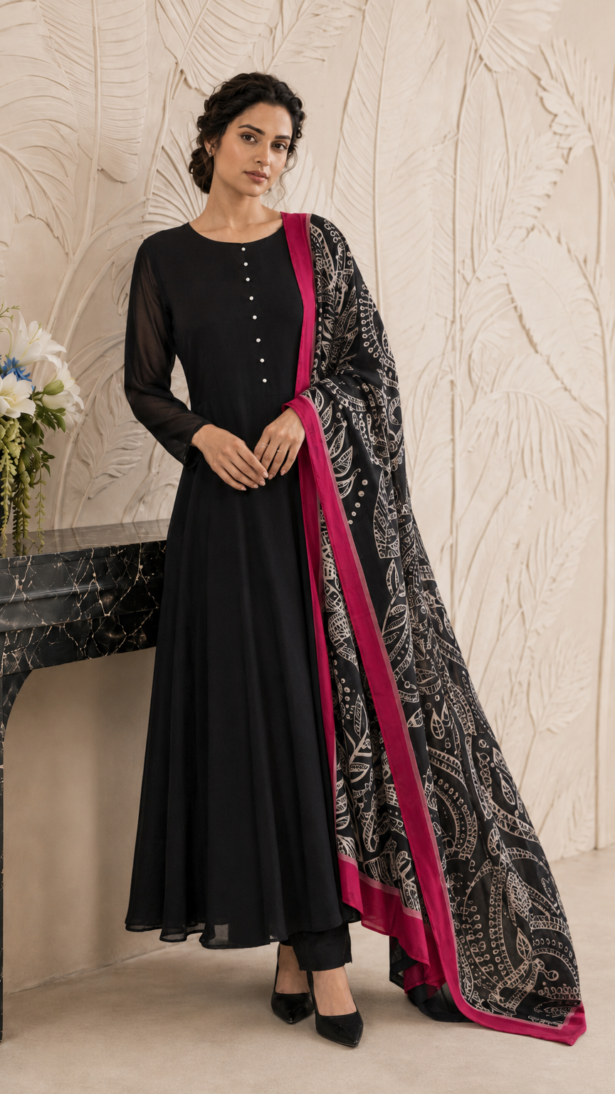 Black women’s Anarkali salwar kameez suit with matching trousers and black paisley printed dupatta with pink border, elegant Asian ethnic wear by Diya Online