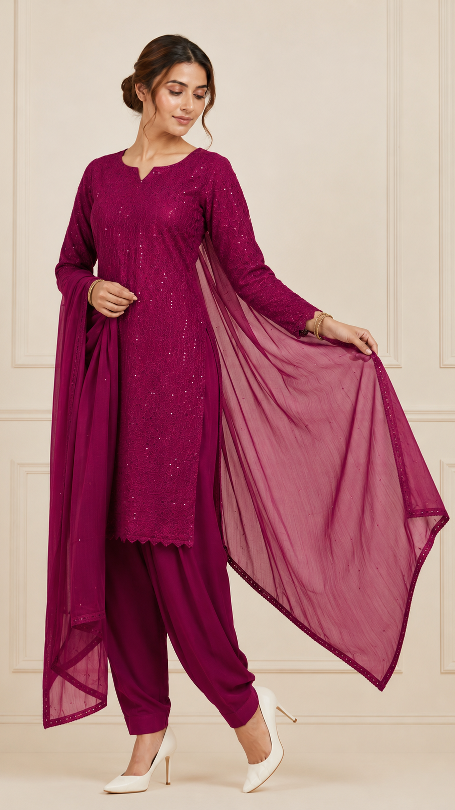 Woman wearing a deep magenta embroidered kurta set with matching salwar trousers and dupatta – Diya Online ethnic wear.