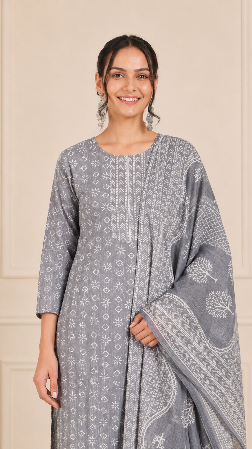 Woman wearing a grey and white printed kurta set with matching trousers and printed dupatta – Diya Online ethnic wear.