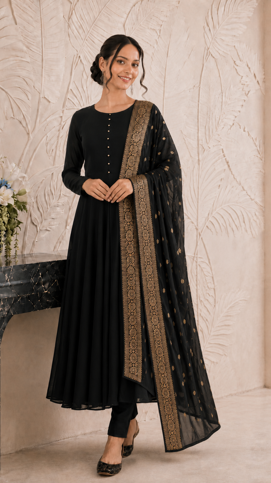 Woman wearing a black Anarkali suit with gold embroidered dupatta and trousers – Diya Online ethnic wear.