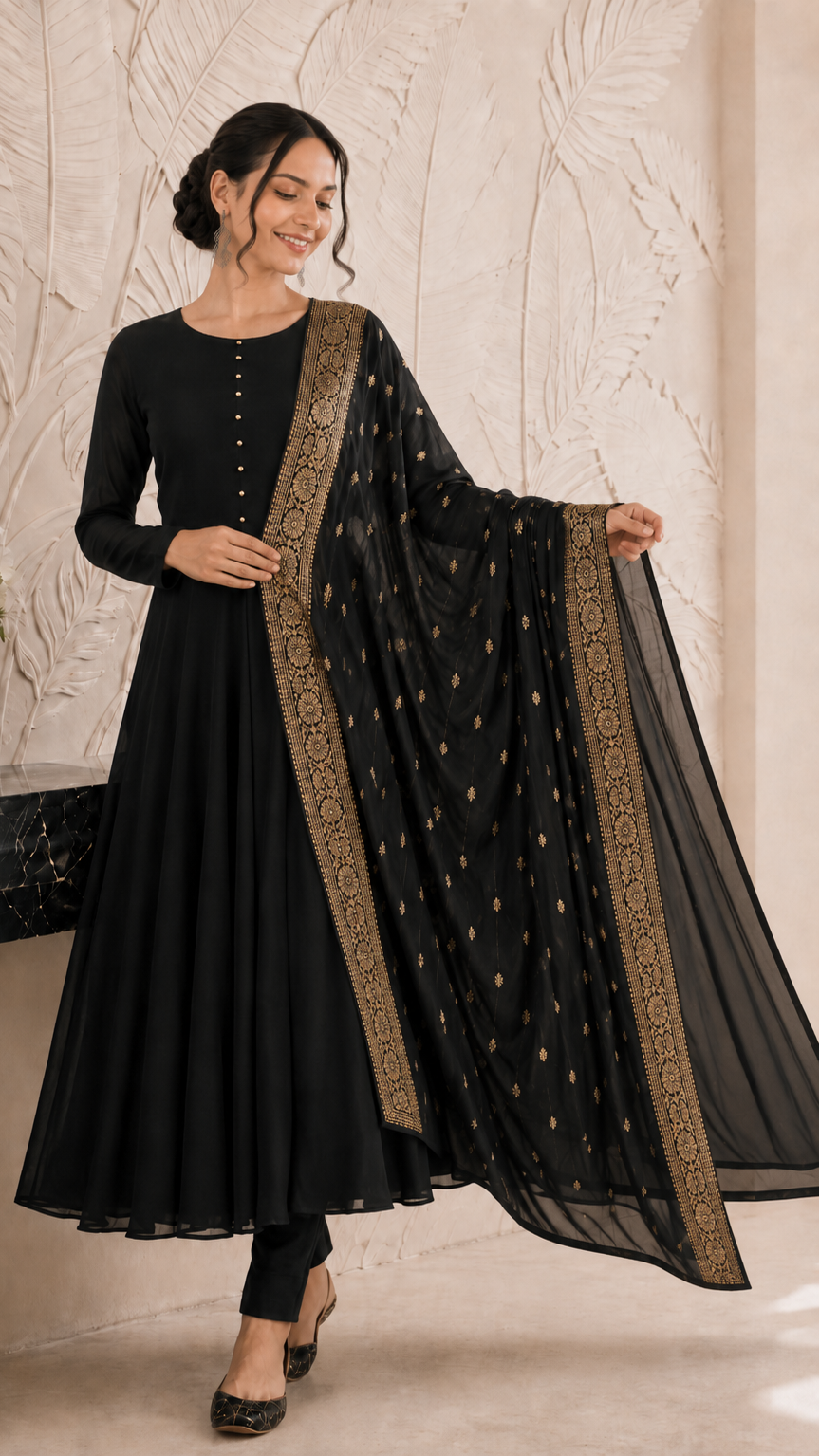 Woman wearing a black Anarkali suit with gold embroidered dupatta and trousers – Diya Online ethnic wear.