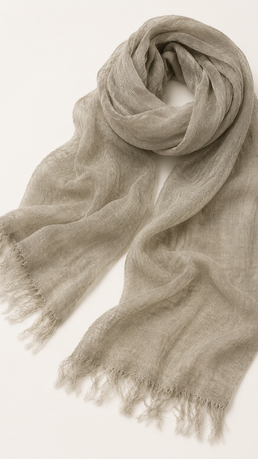 A light taupe-beige scarf with fringed edges.