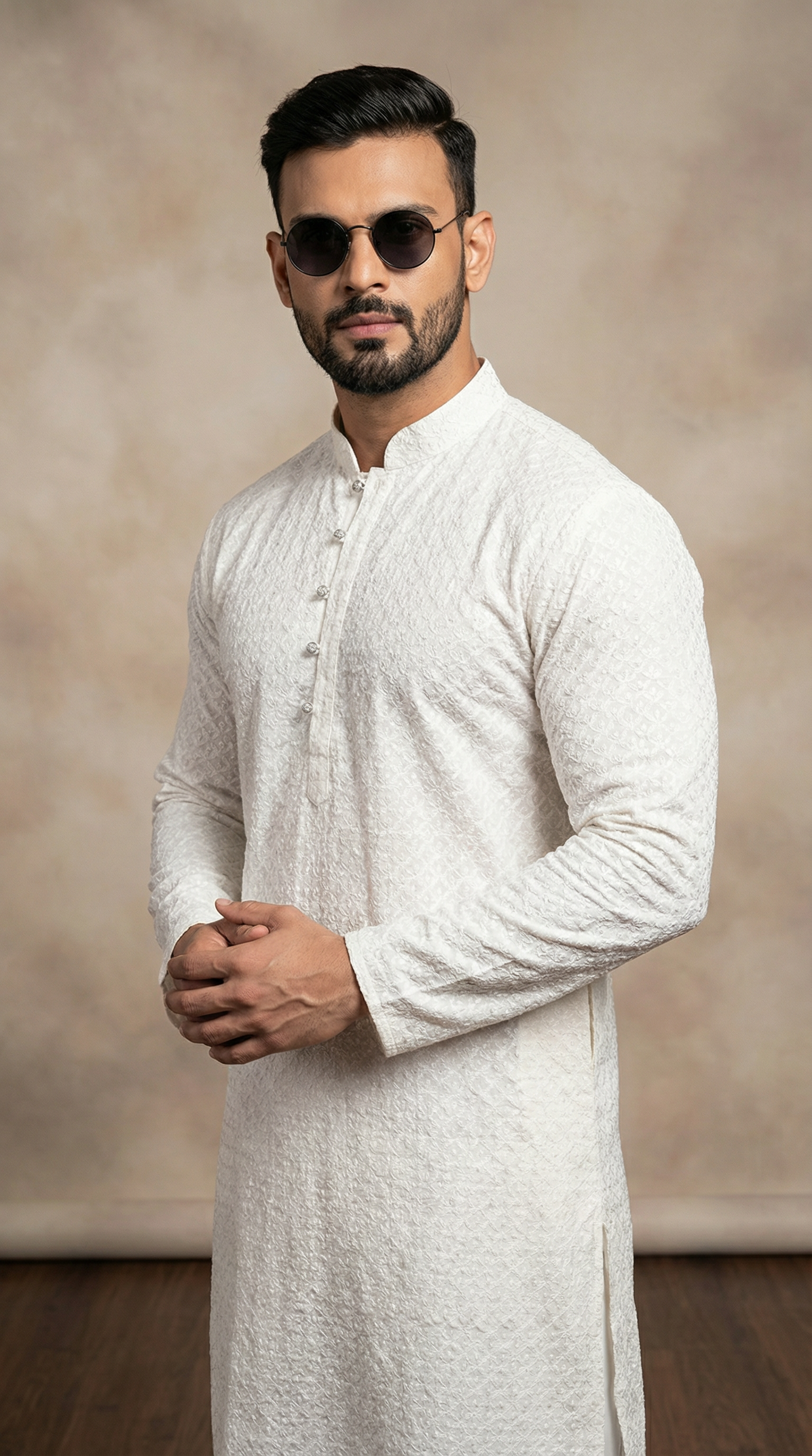 Men’s white jacquard kurta pyjama featuring premium textured fabric kurta with mandarin collar, buttoned placket, and matching white pyjama. Traditional men’s ethnic wear for weddings, Eid, festive occasions, and formal cultural events.