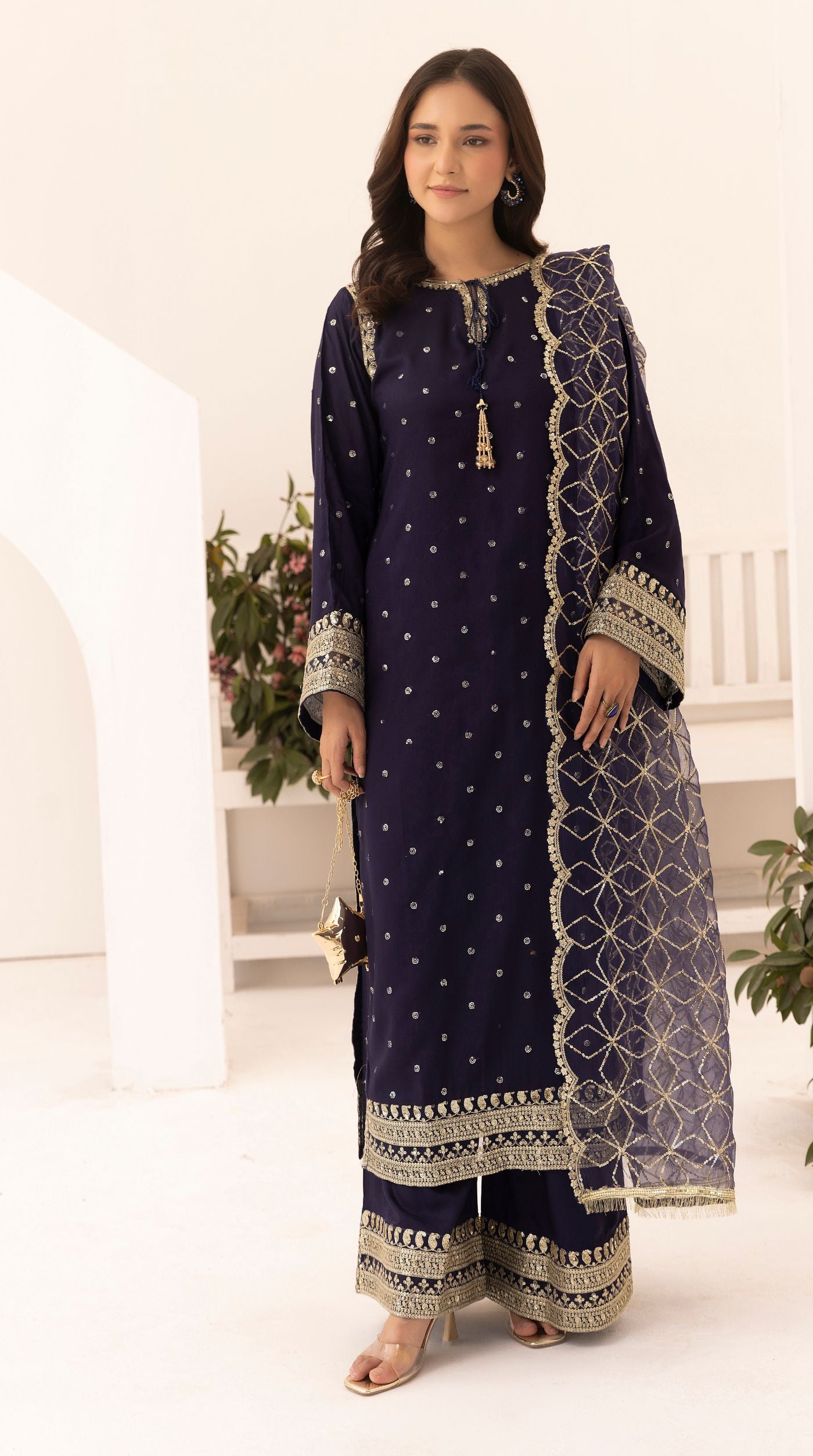Midnight-blue embroidered viscose suit set with embellished detailing and an intricately embroidered net dupatta.