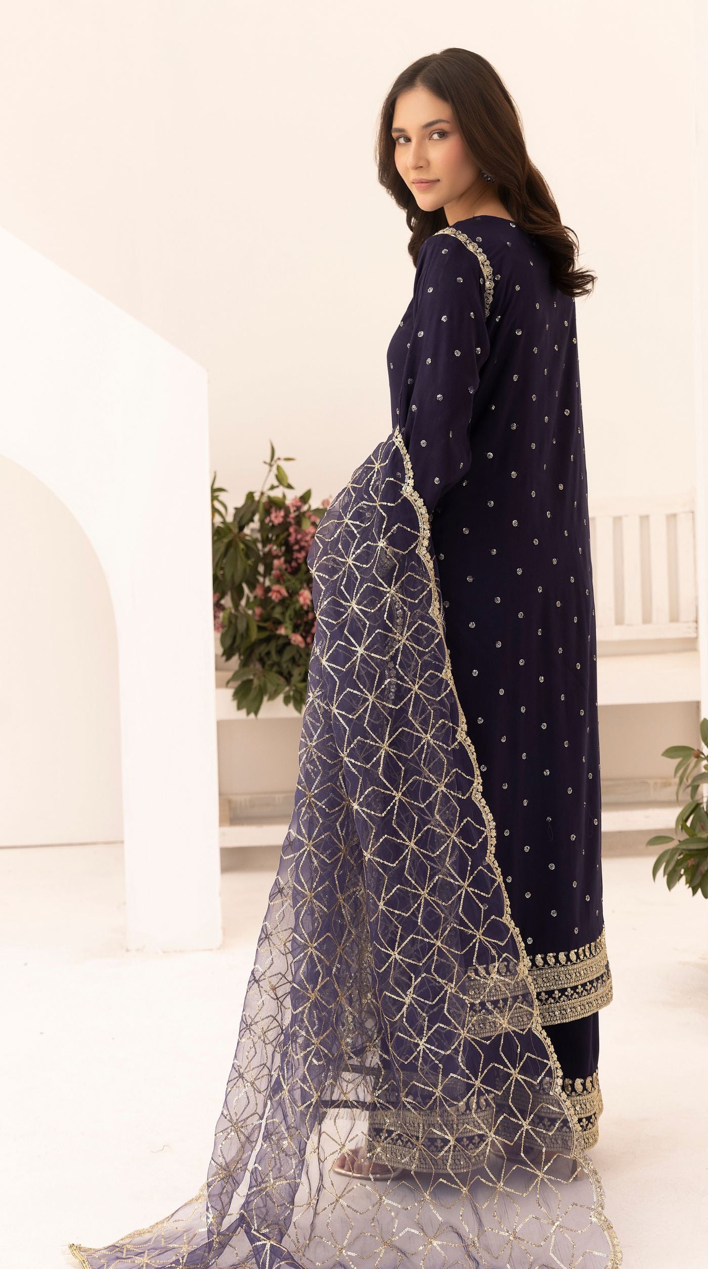 Midnight-blue embroidered viscose suit set with embellished detailing and an intricately embroidered net dupatta.