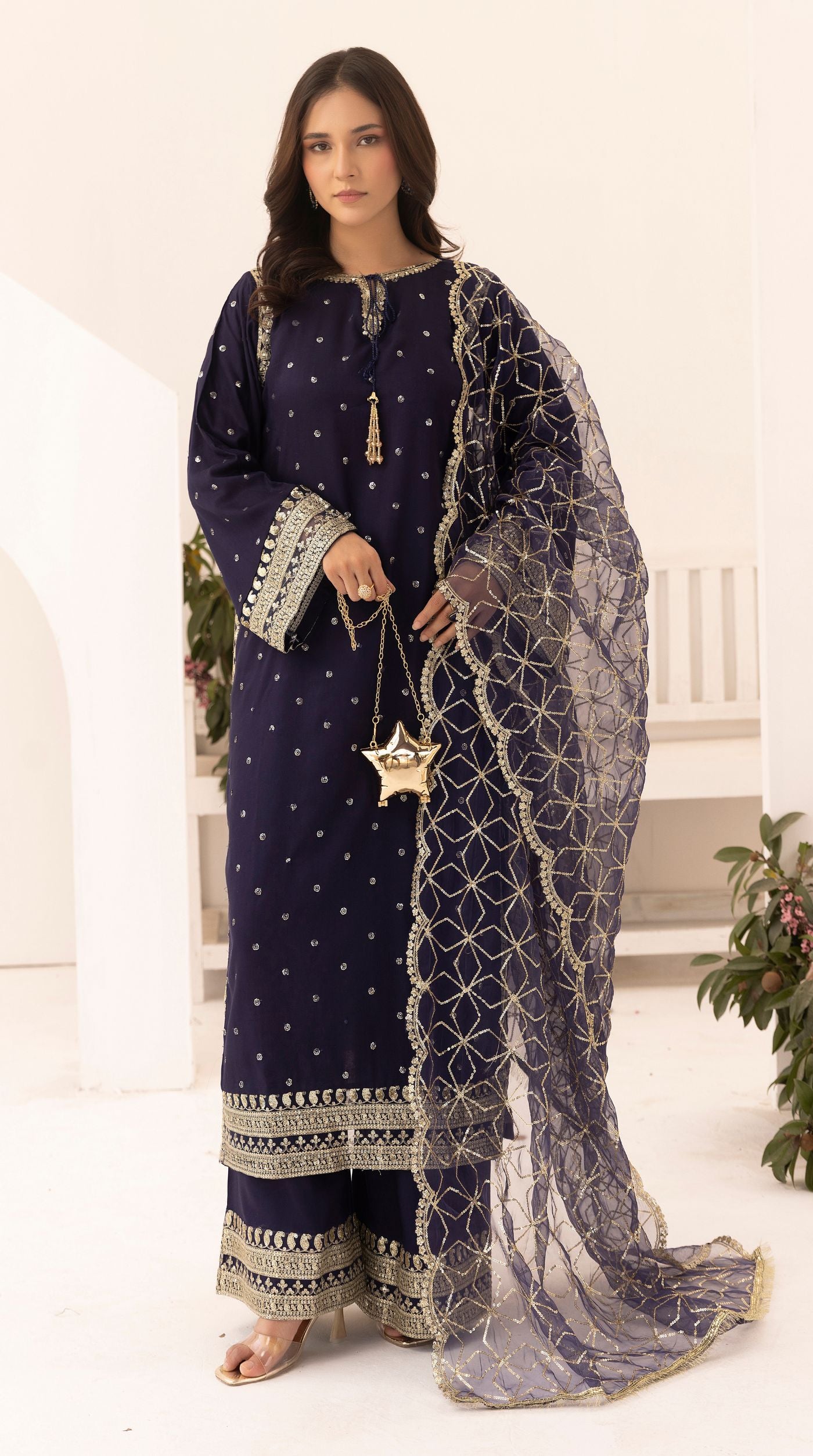 Midnight-blue embroidered viscose suit set with embellished detailing and an intricately embroidered net dupatta.