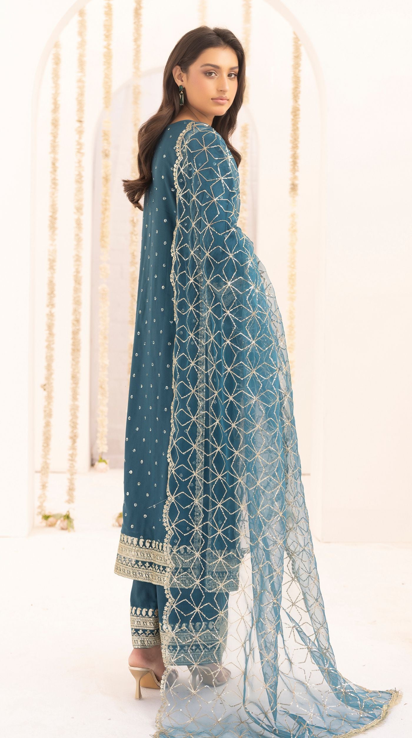 Teal embroidered viscose suit set with embellished detailing and an intricately embroidered net dupatta.