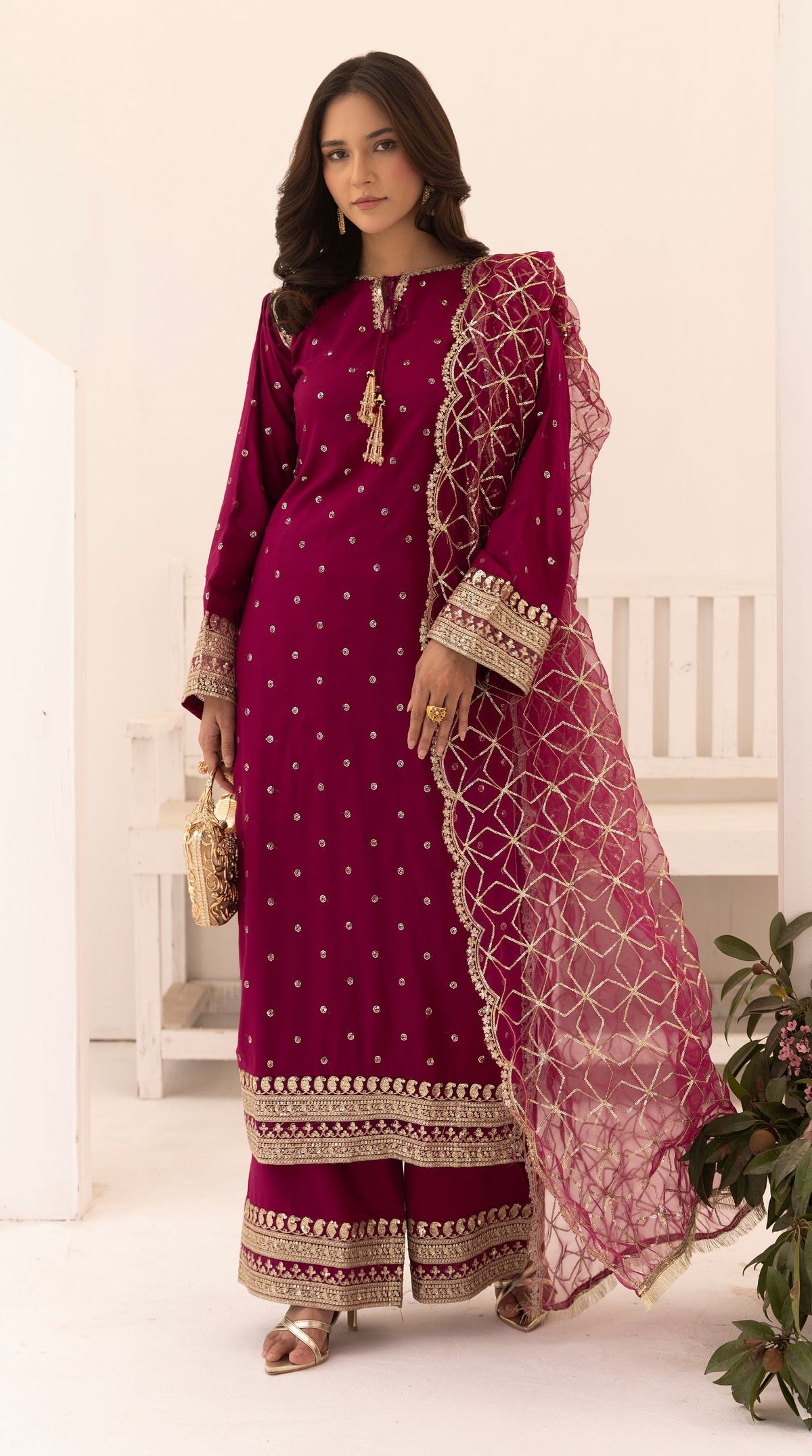 Magenta embroidered viscose suit set with embellished detailing and an intricately embroidered net dupatta.