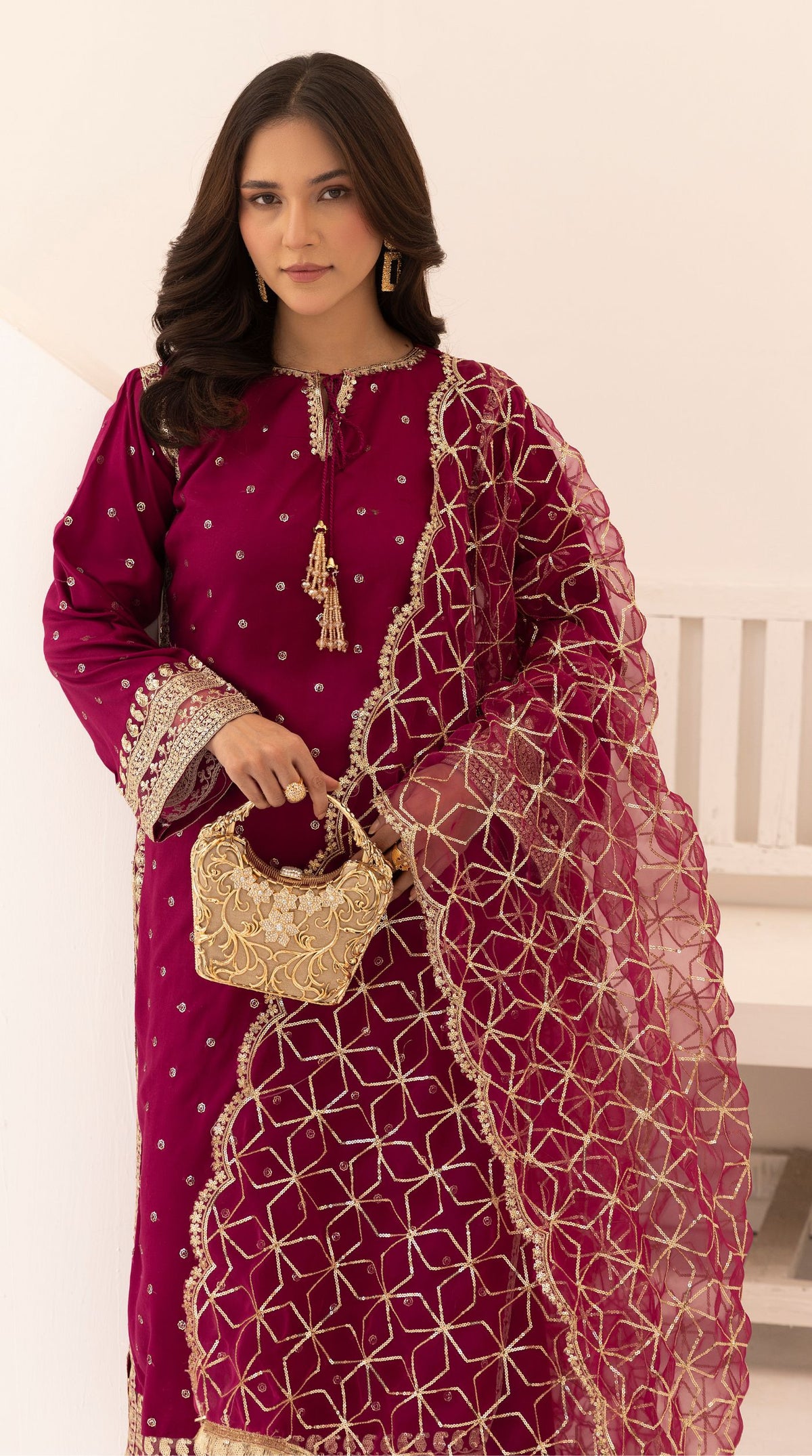 Magenta embroidered viscose suit set with embellished detailing and an intricately embroidered net dupatta.
