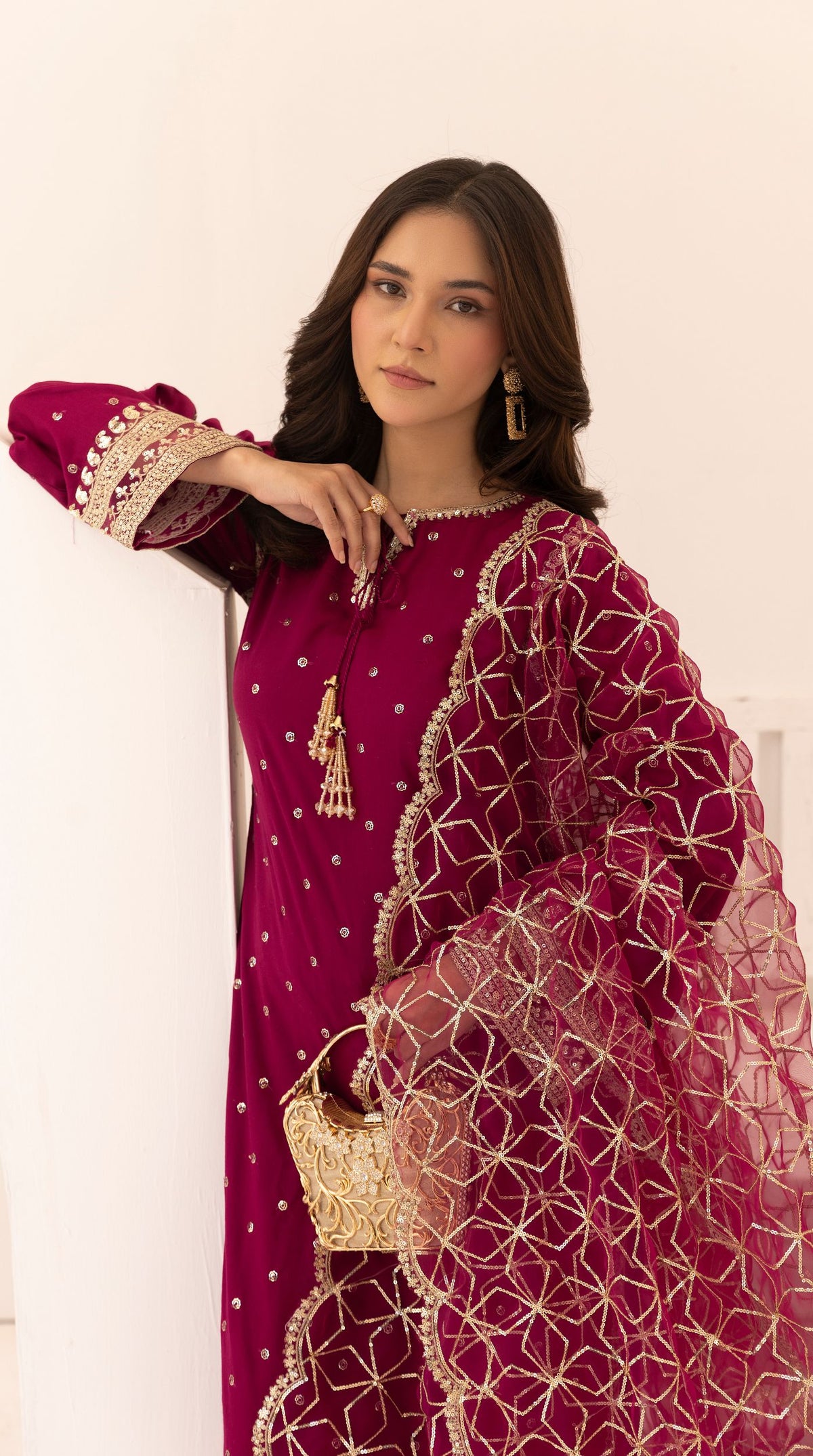 Magenta embroidered viscose suit set with embellished detailing and an intricately embroidered net dupatta.