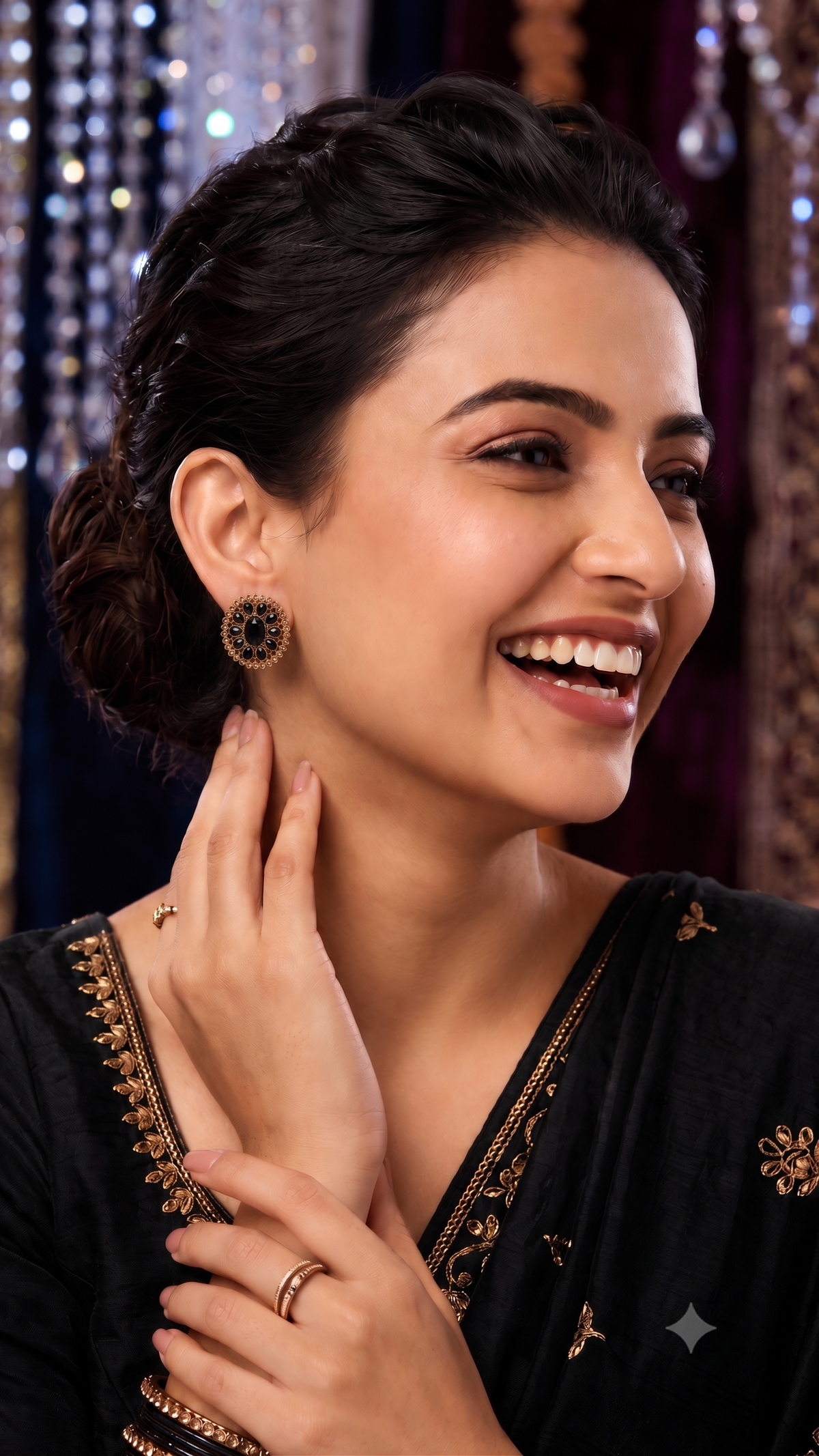 Model wearing black crystal stellar earrings with elegant oval design
