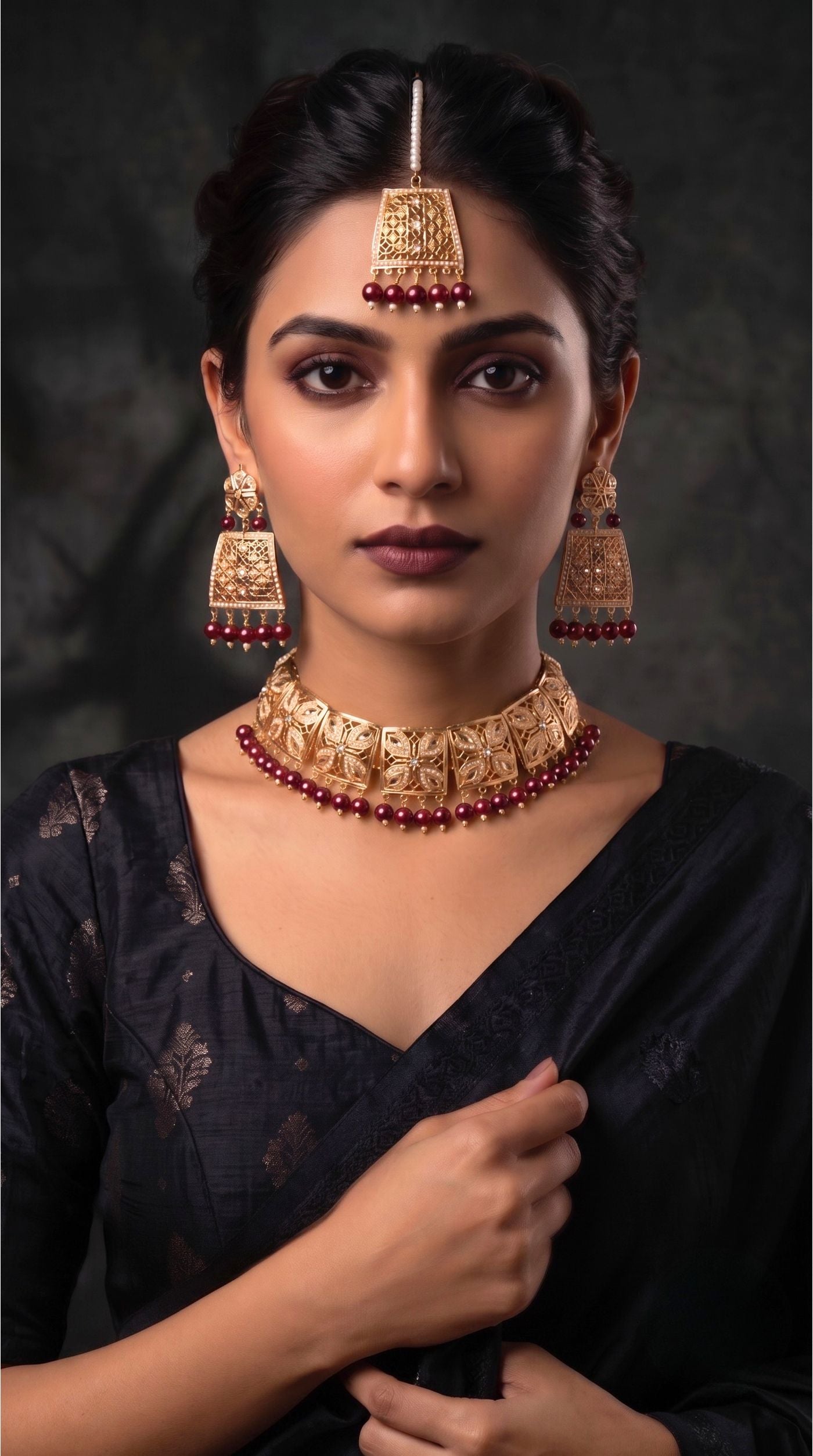 Gold Maroon Jadau necklace set with matching statement earrings and maang tikka featuring intricate filigree work and Maroon bead detailing 