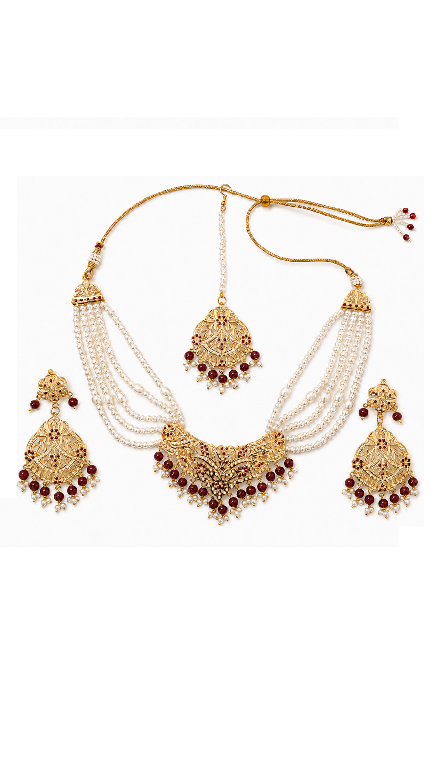 Gold-toned traditional Jadau jewelry set featuring a necklace with multiple strands of white pearls and red stone accents.