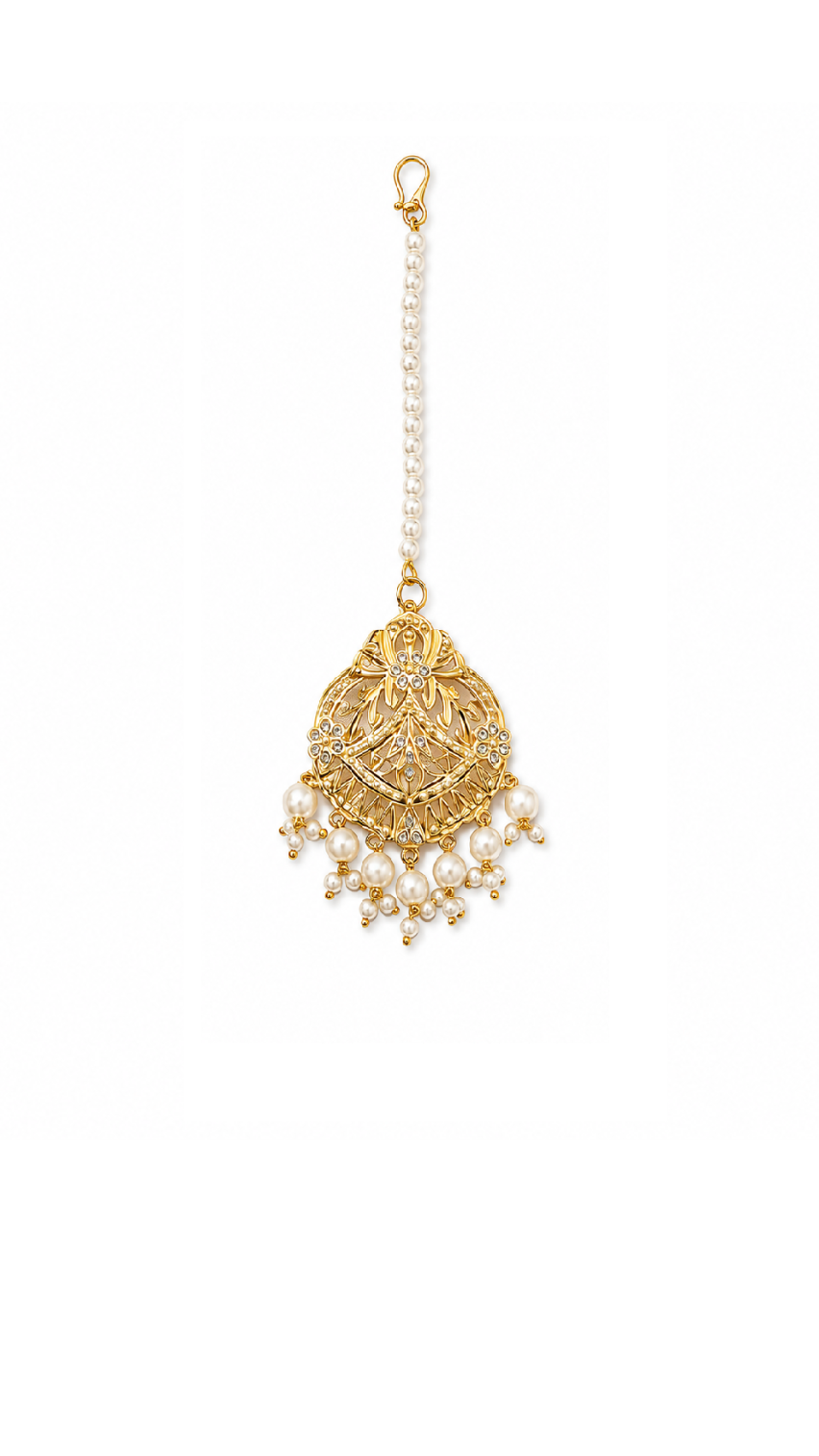 Gold-toned traditional Indian jadau earrings with white faux pearls.