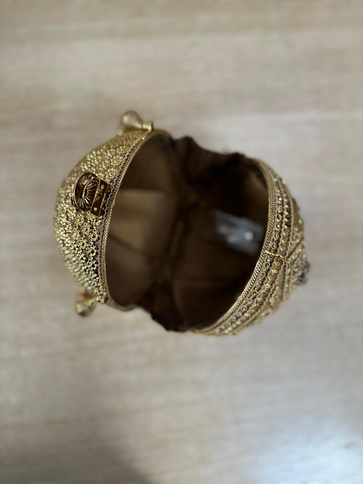 Round Metallic Carved Potli Bag
