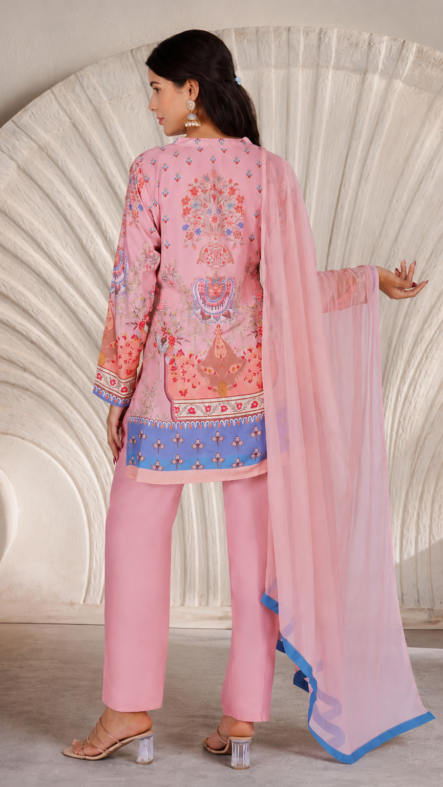 Pink printed salwar kameez suit with straight trousers and sheer matching dupatta with blue trim
