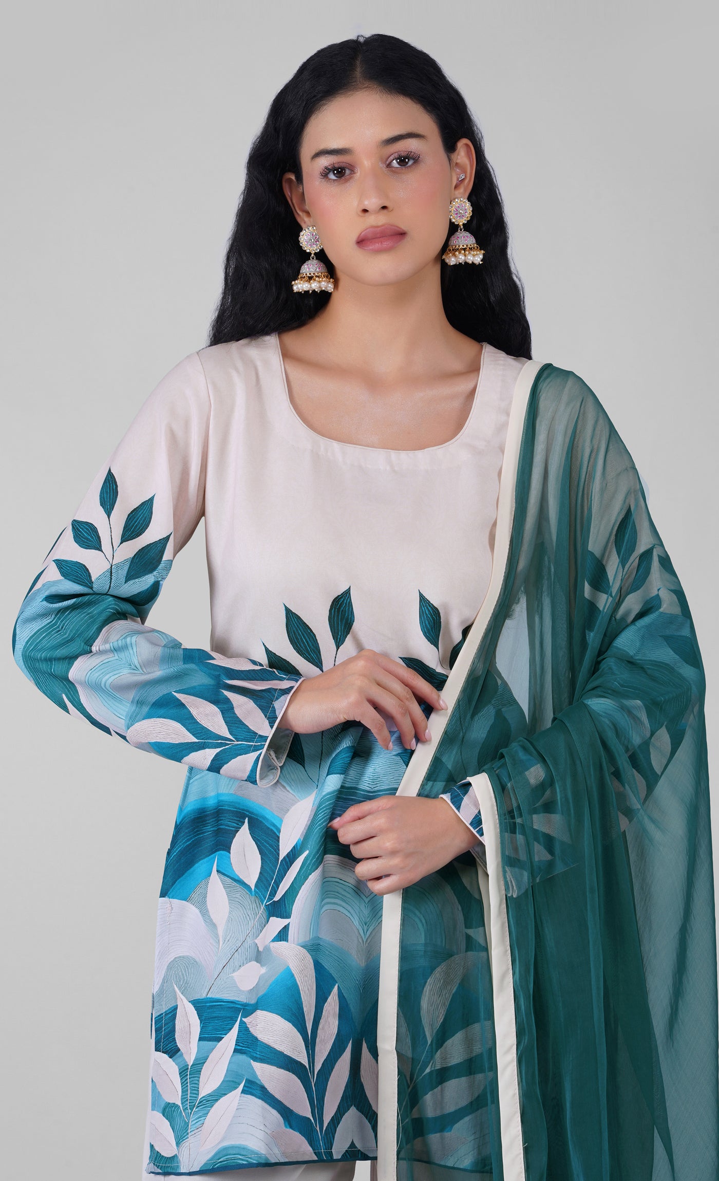 Side profile of off white rayon suit with teal dupatta