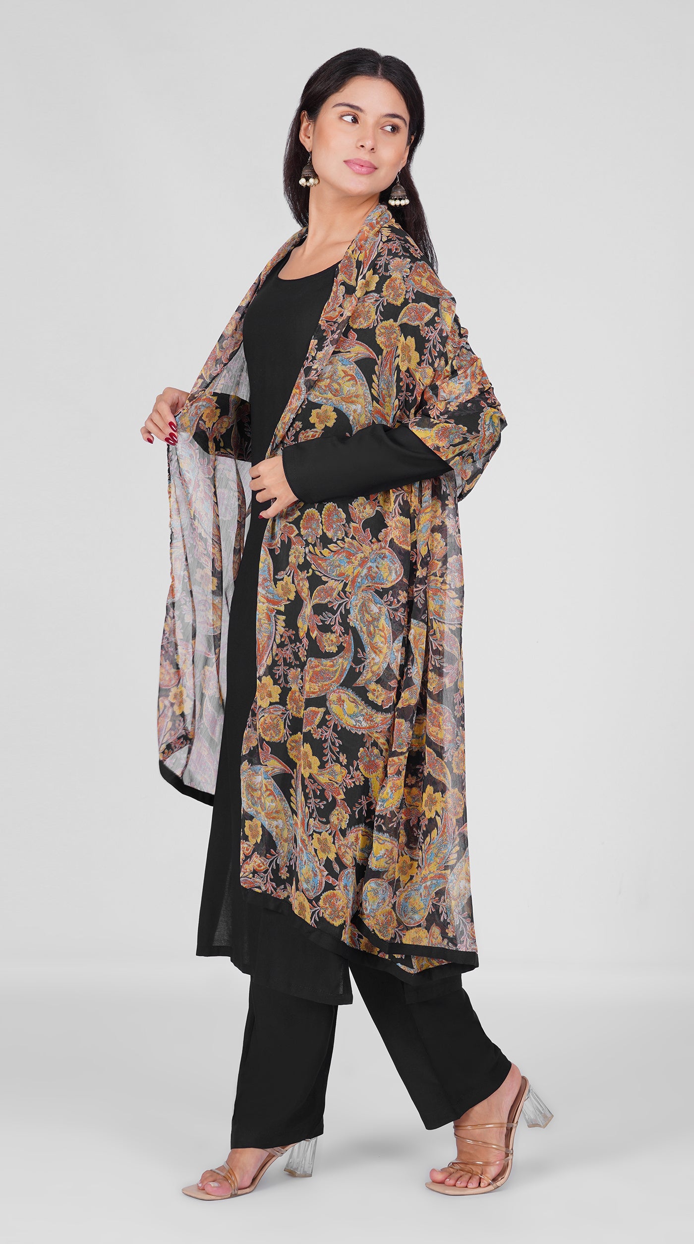 Black straight cut suit set modeled with a plain black kurta and pants paired with a sheer vintage paisley and floral printed georgette dupatta 
