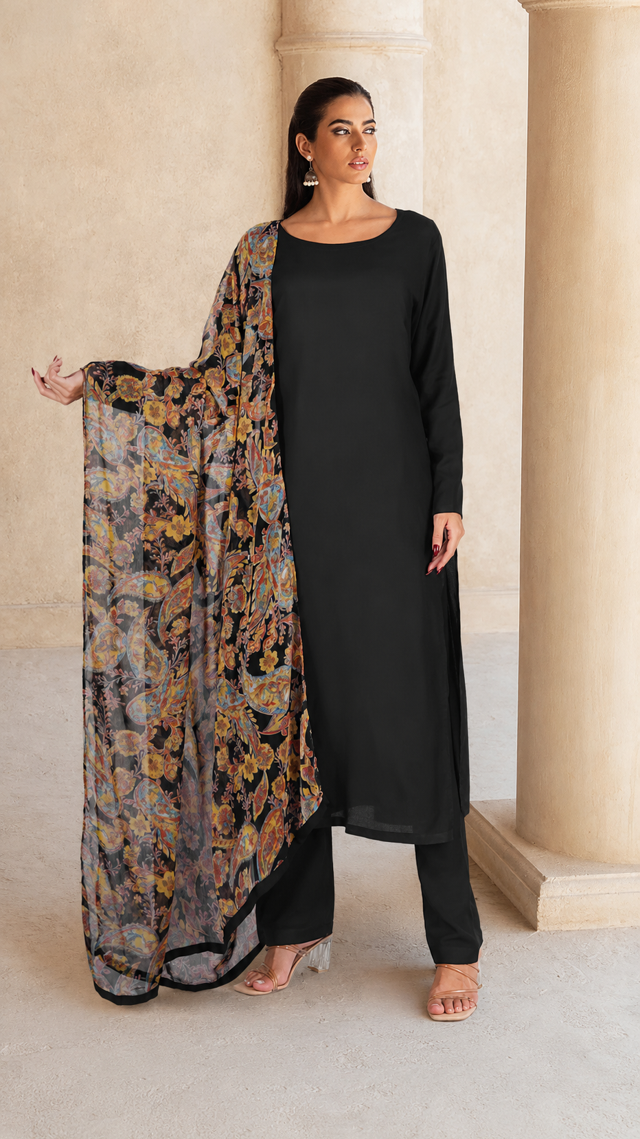 Black salwar kameez suit with matching trousers and multicolour paisley print dupatta
