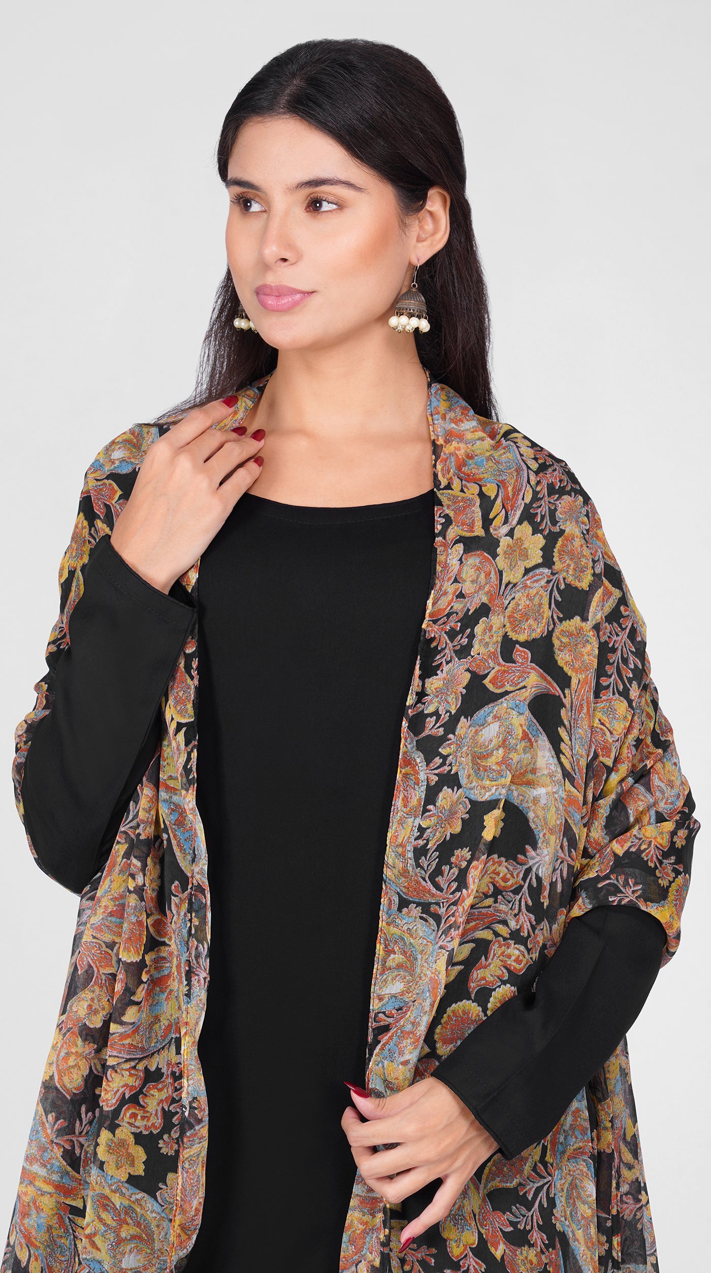 Black straight cut suit set modeled with a plain black kurta and pants paired with a sheer vintage paisley and floral printed georgette dupatta 