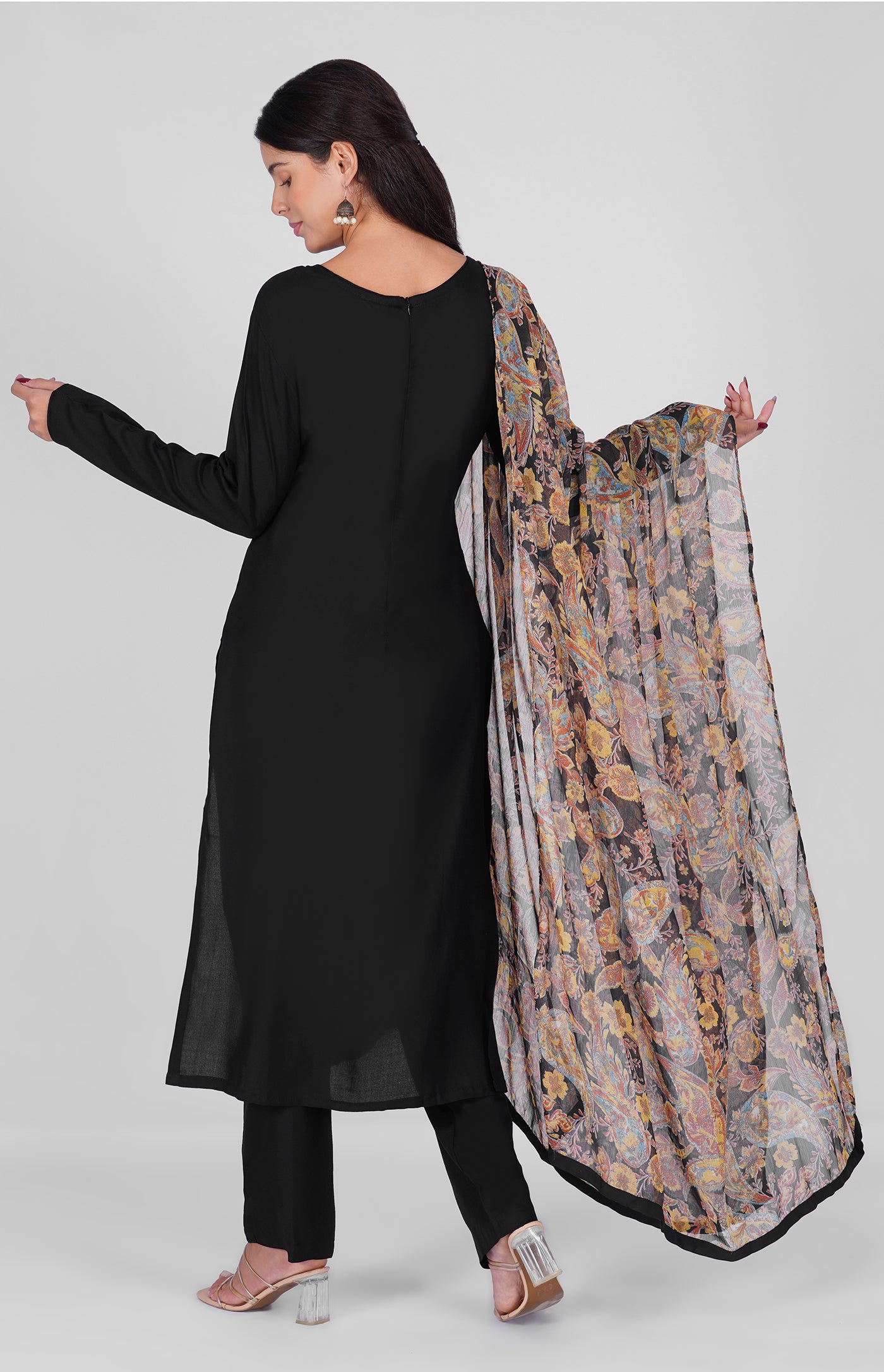 Black straight cut suit set modeled with a plain black kurta and pants paired with a sheer vintage paisley and floral printed georgette dupatta 